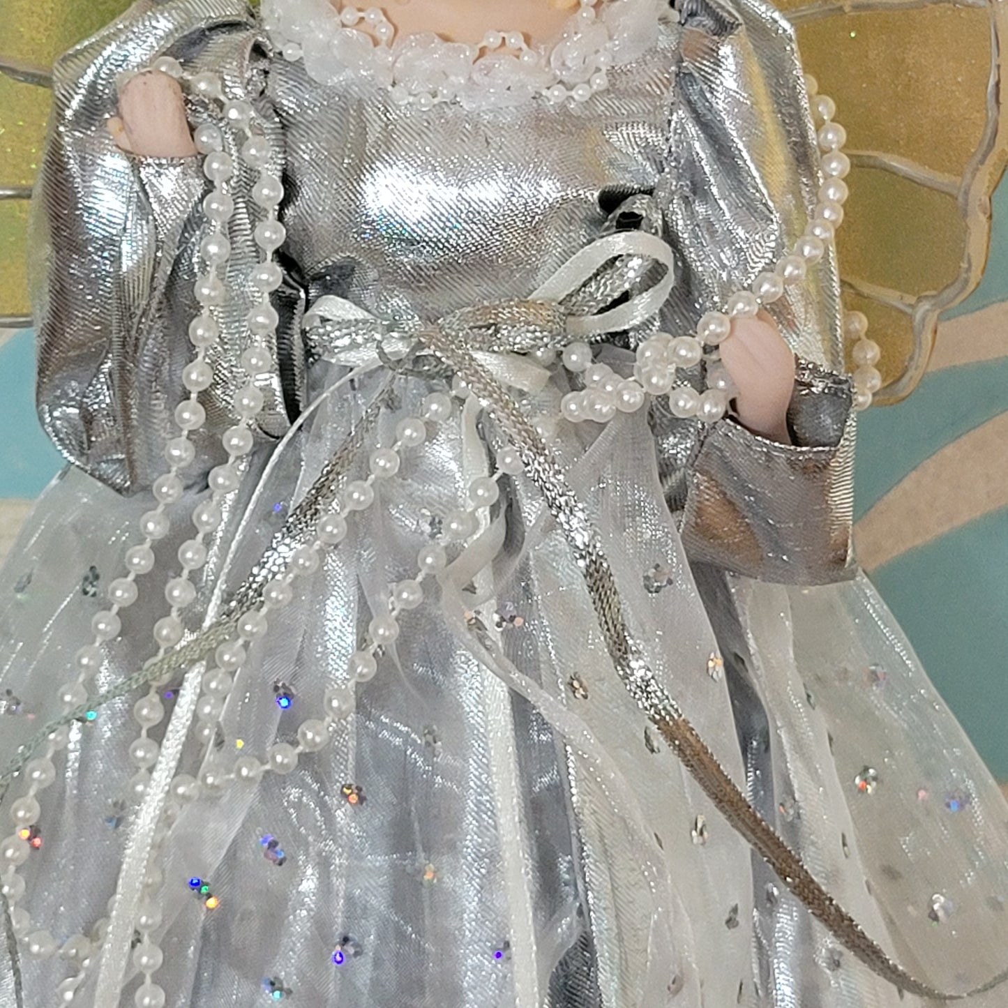 Vintage Christmas angel tree topper in silver dress with gold/silver wings