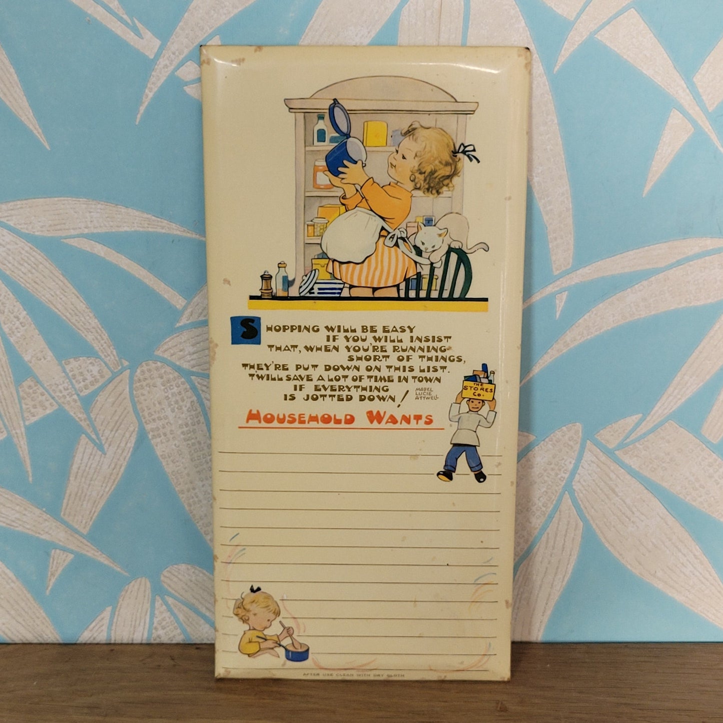 circa. 1940s/50s Lucy Mabel-Attwell illustrated "Household Wants" wipe-clean memo board