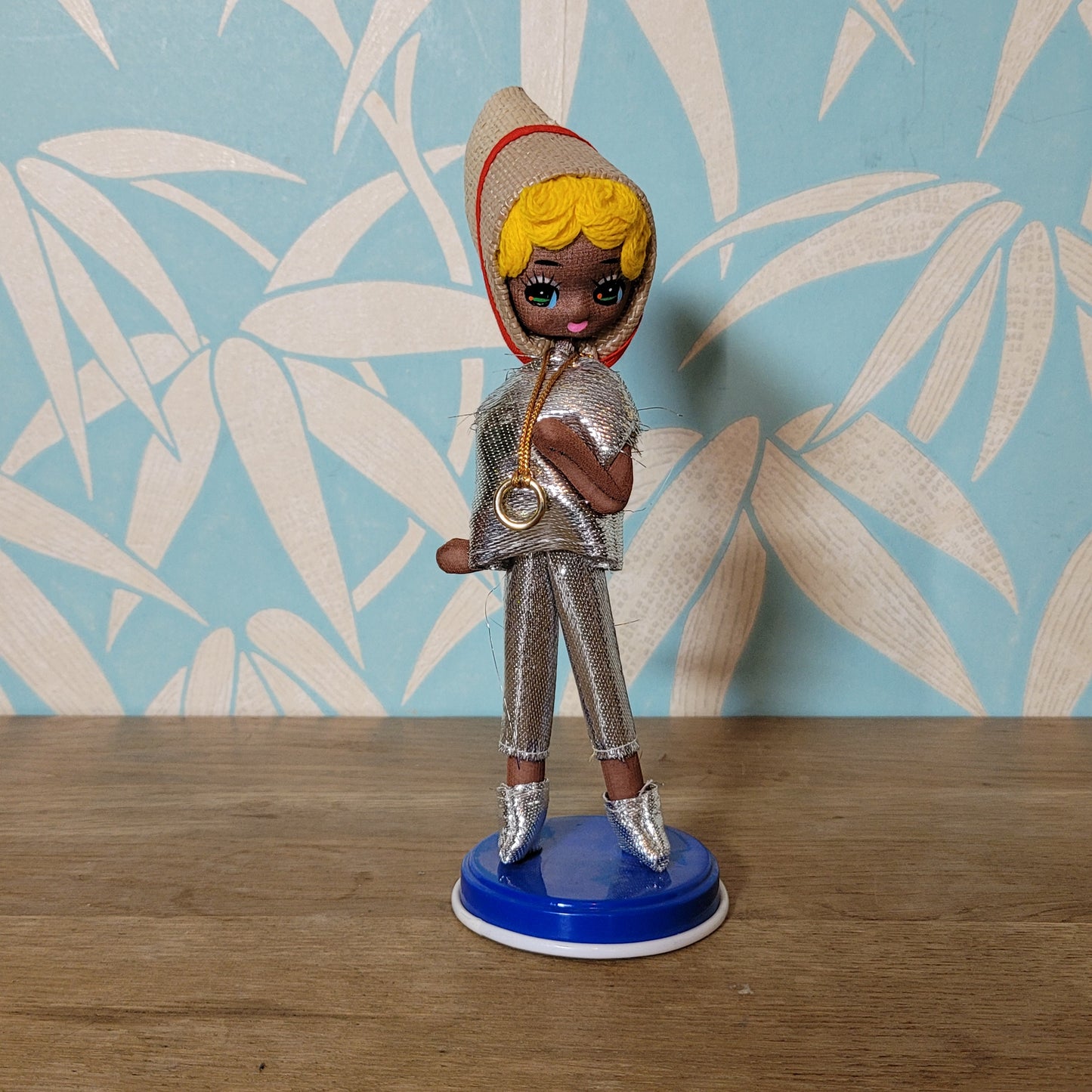 Pair of cute 1960s Bradley big eye pose dolls in co-ordinating metallic silver, & gold outfits