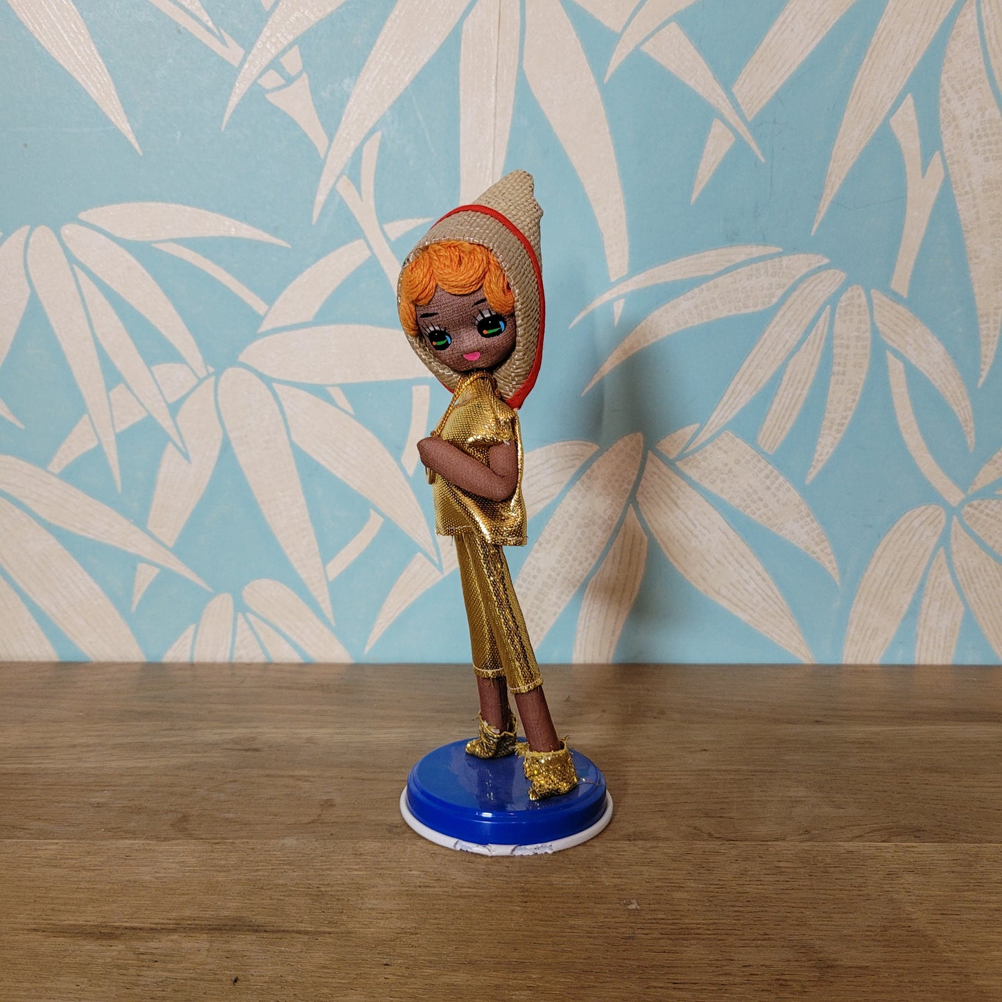 Pair of cute 1960s Bradley big eye pose dolls in co-ordinating metallic silver, & gold outfits