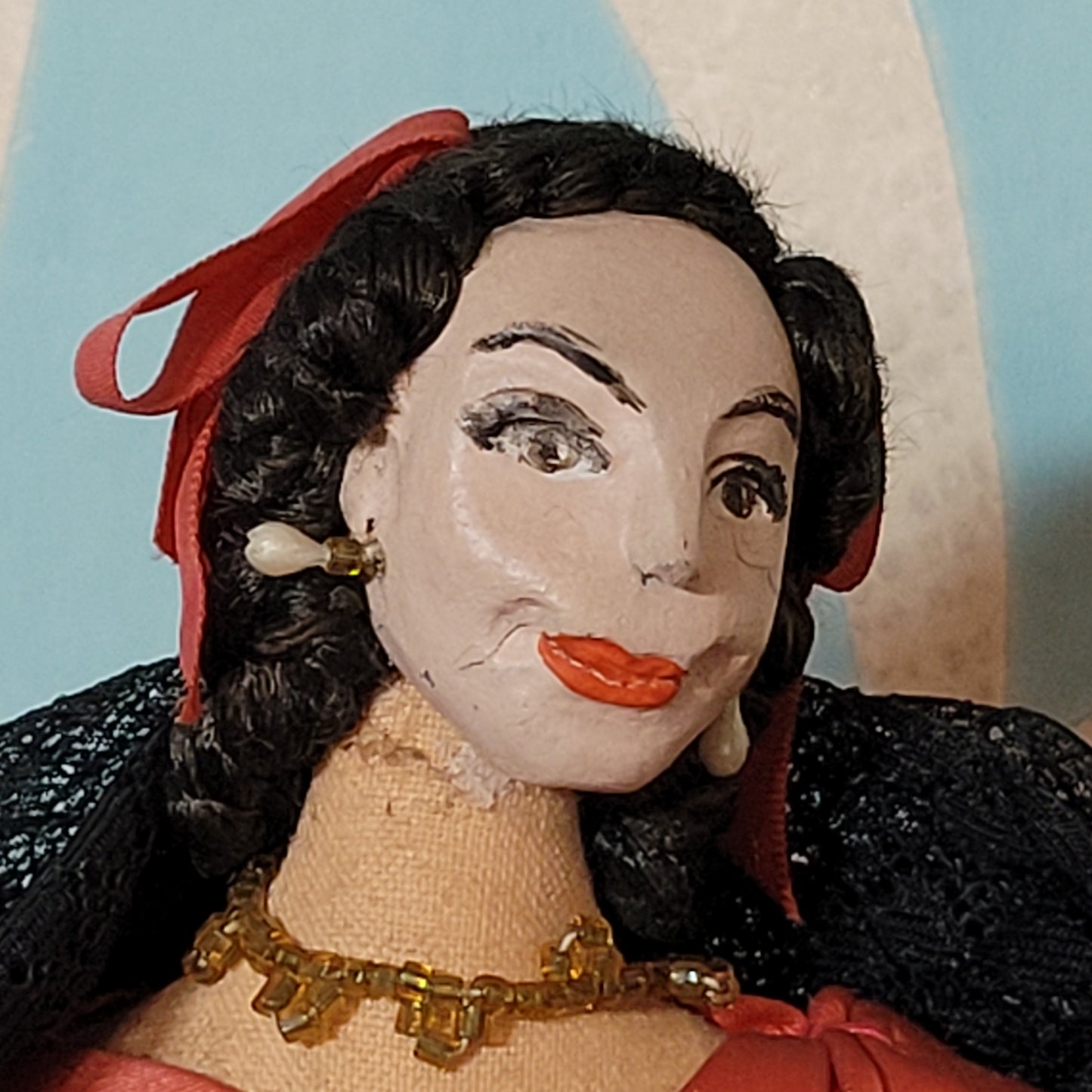 Vintage Spanish lady in red dress pose doll, hand-painted face