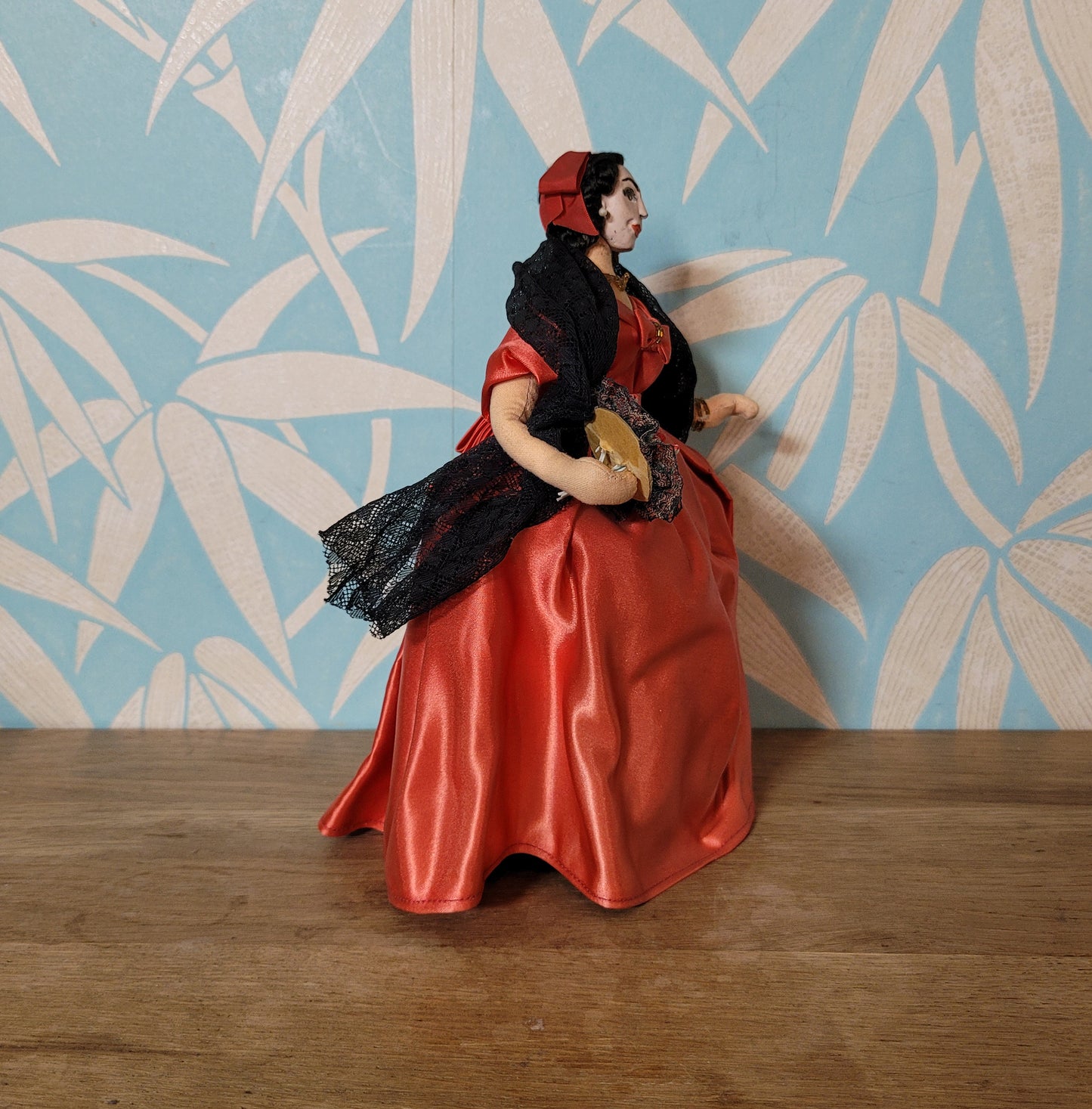 Vintage Spanish lady in red dress pose doll, hand-painted face