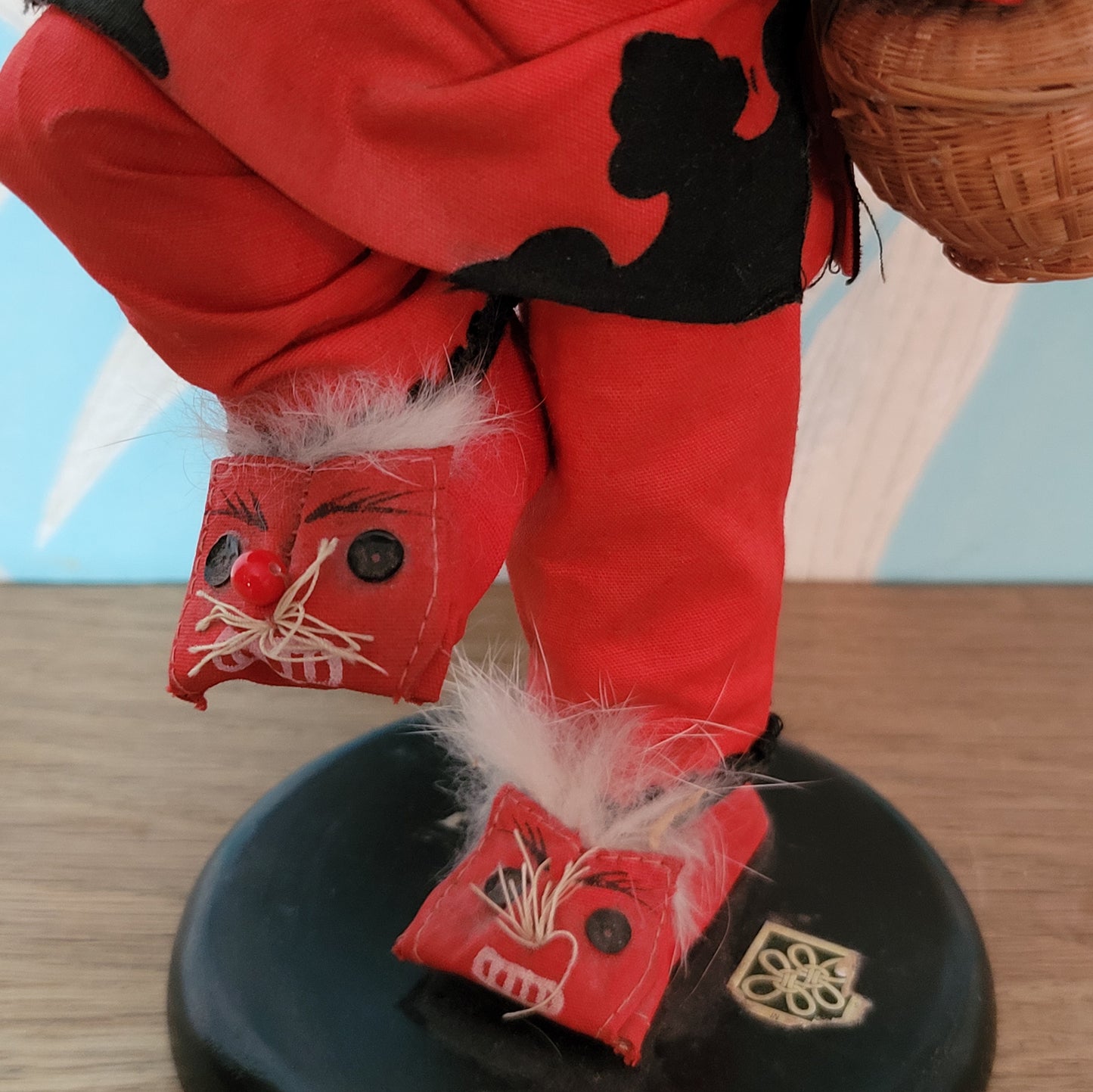 Vintage oriental pose-doll carrying basket, in traditional costume