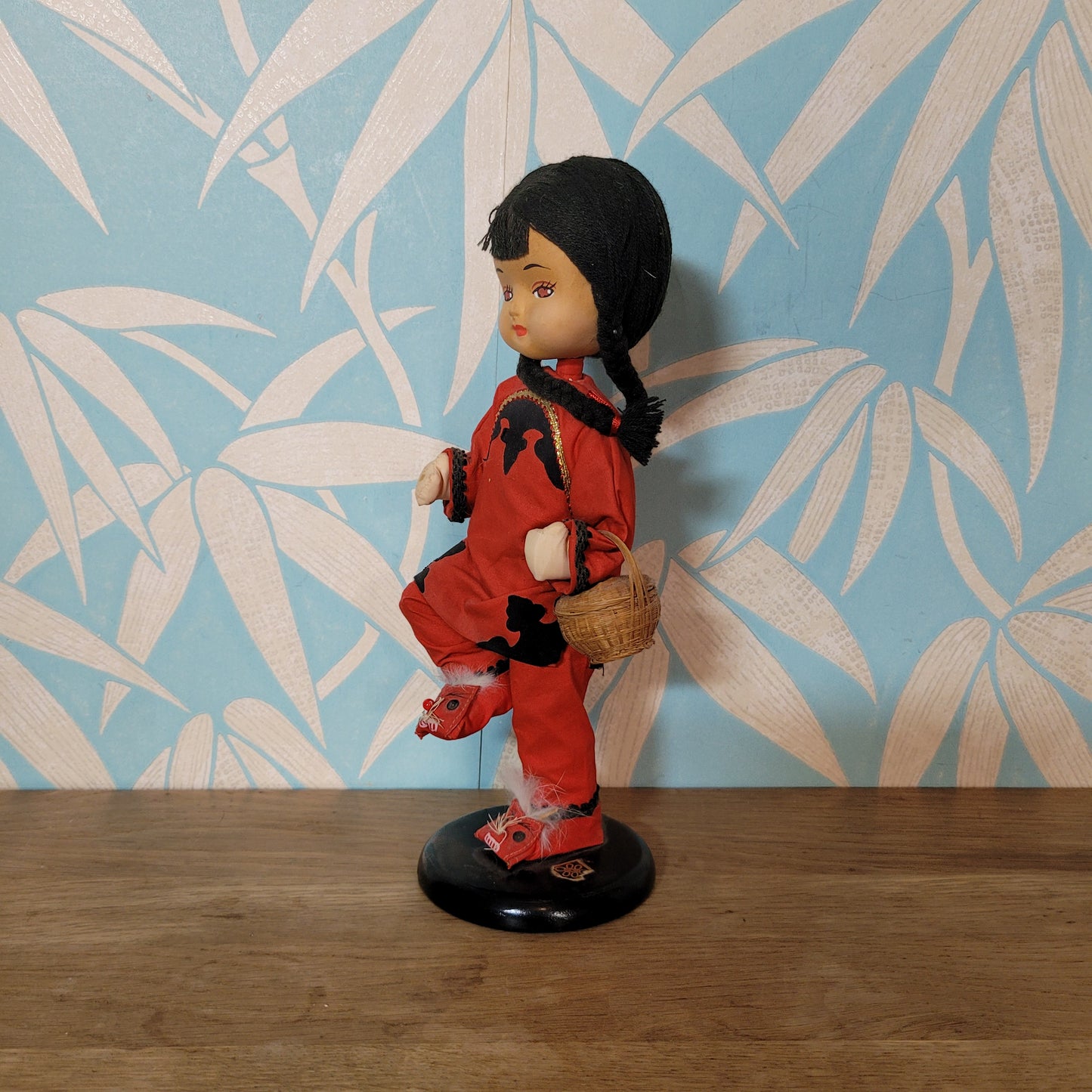 Vintage oriental pose-doll carrying basket, in traditional costume