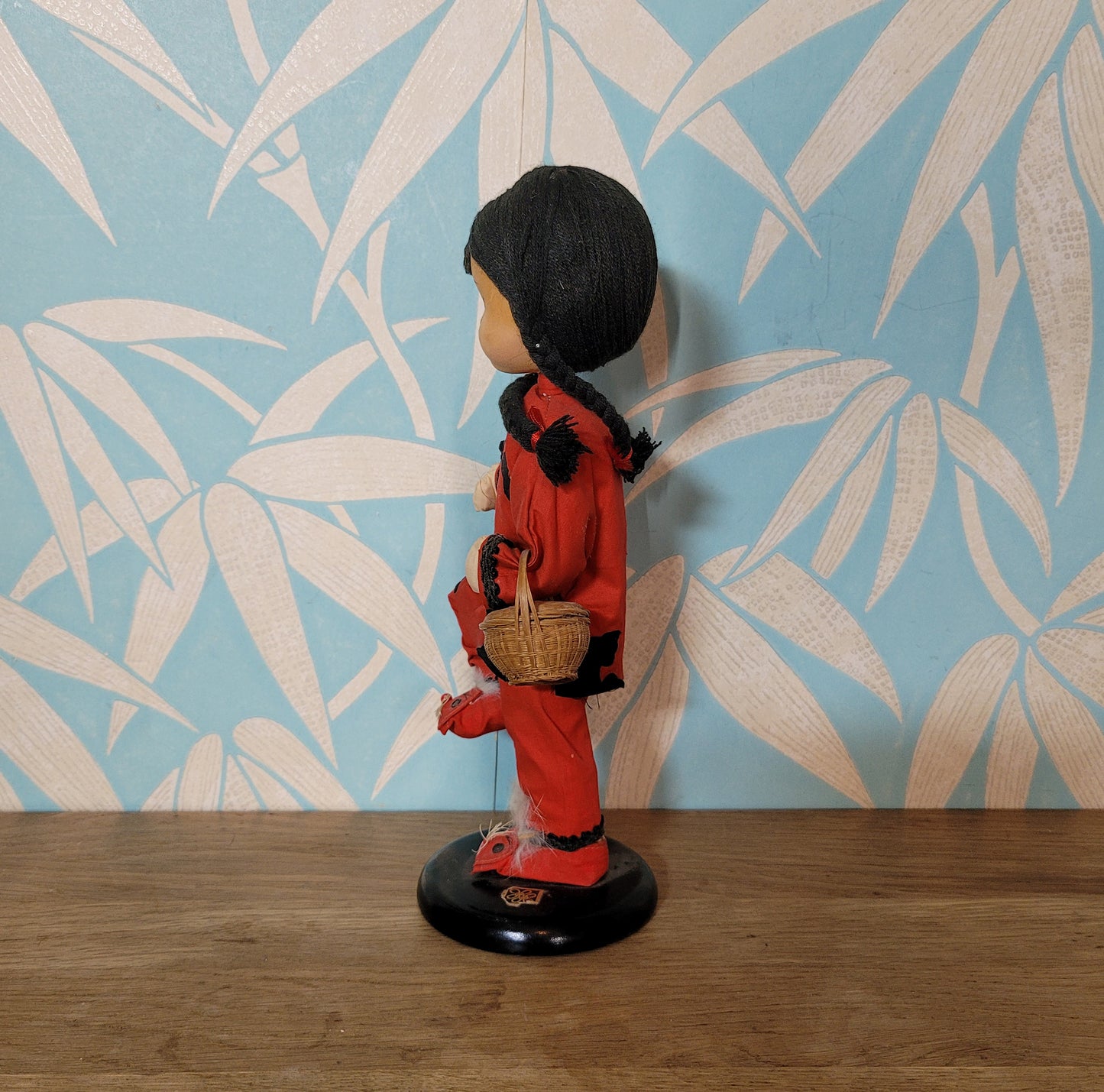 Vintage oriental pose-doll carrying basket, in traditional costume