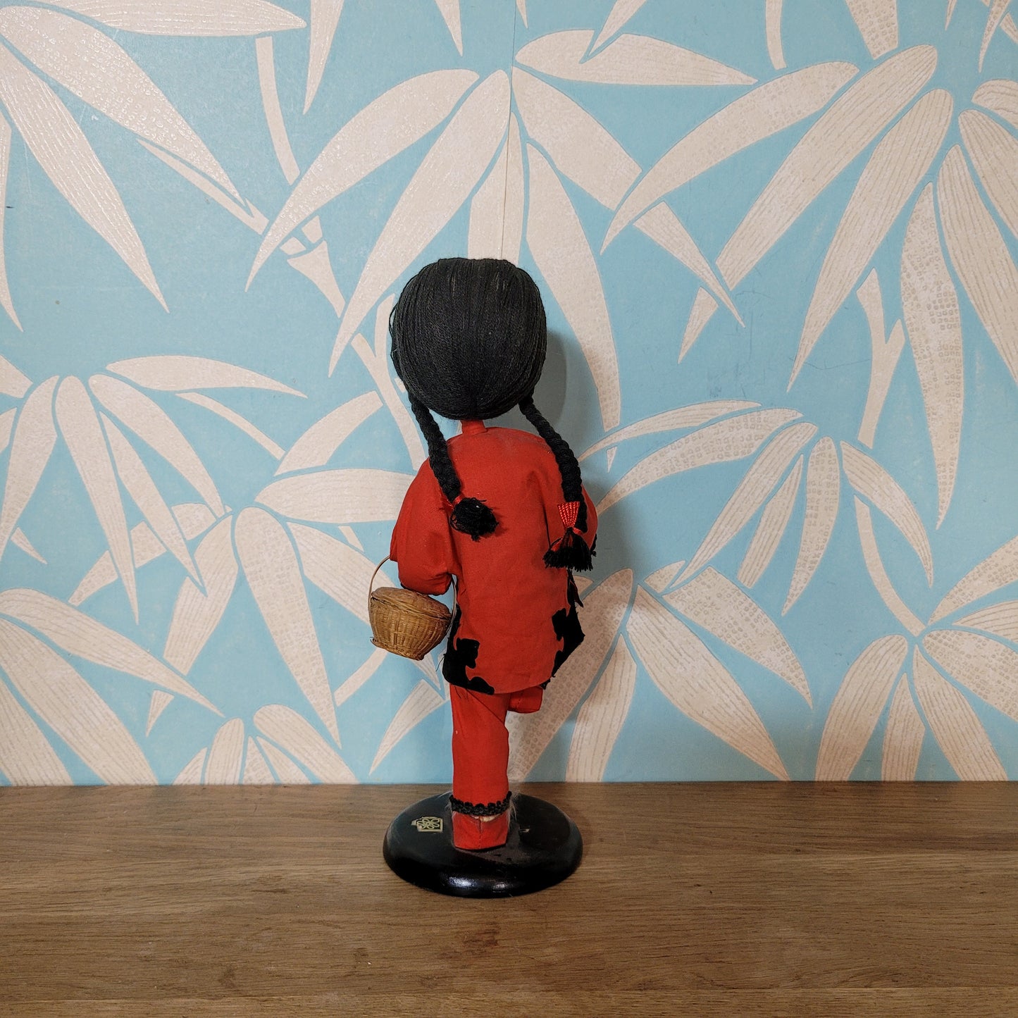 Vintage oriental pose-doll carrying basket, in traditional costume