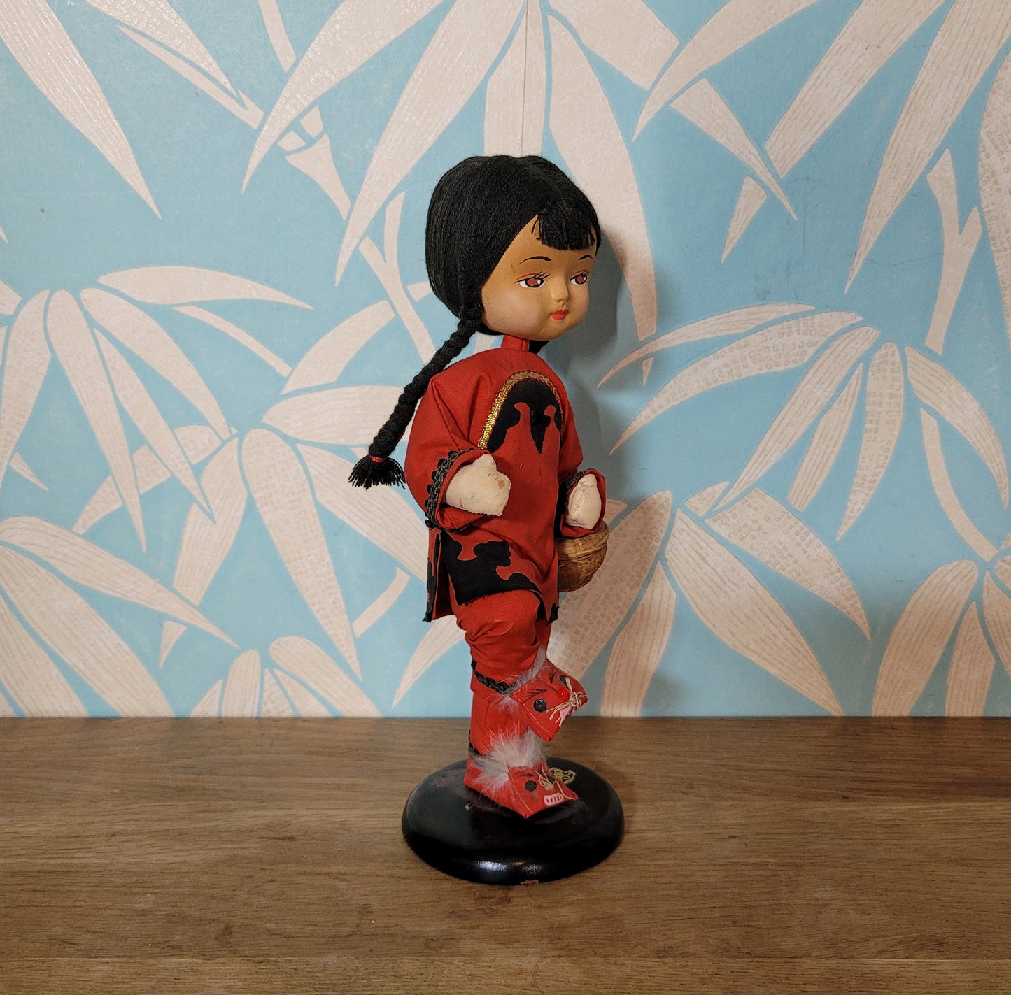 Vintage oriental pose-doll carrying basket, in traditional costume