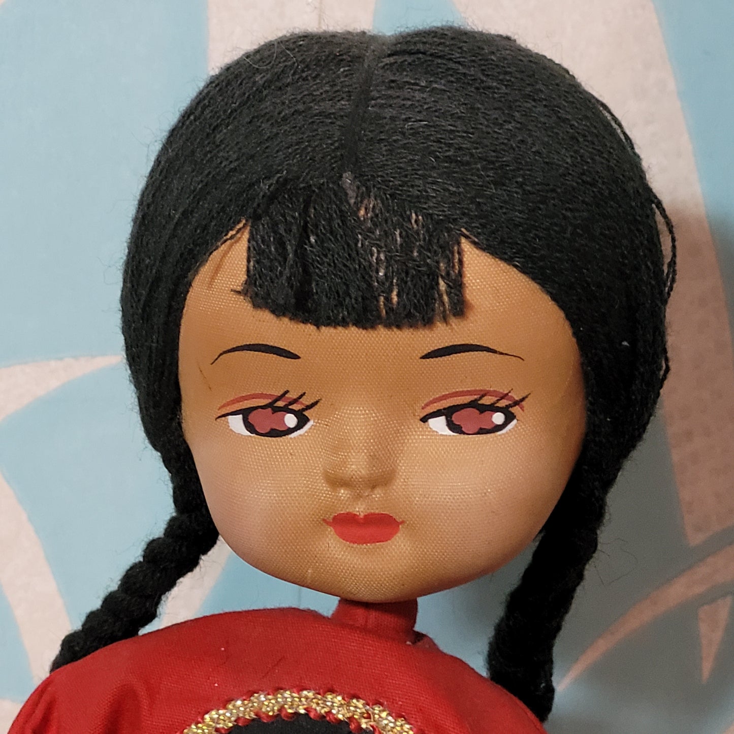 Vintage oriental pose-doll carrying basket, in traditional costume