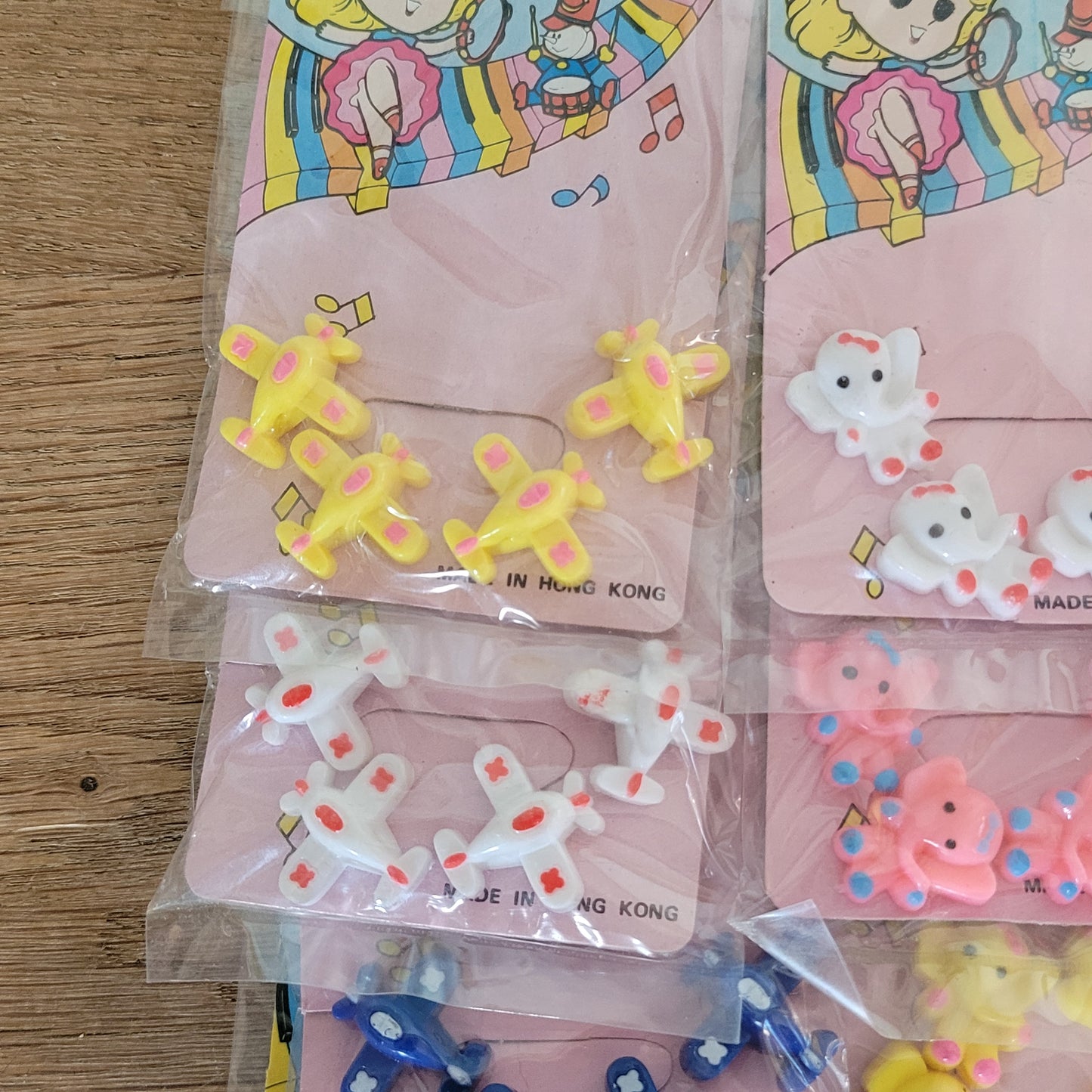 Deadstock sheet display of vintage 'New Fashion' novelty plastic hair bobbles