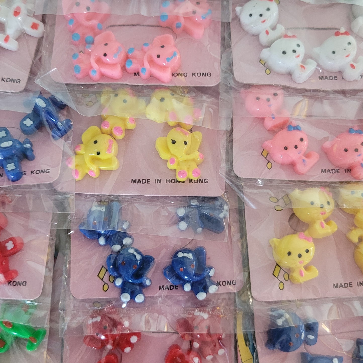 Deadstock sheet display of vintage 'New Fashion' novelty plastic hair bobbles