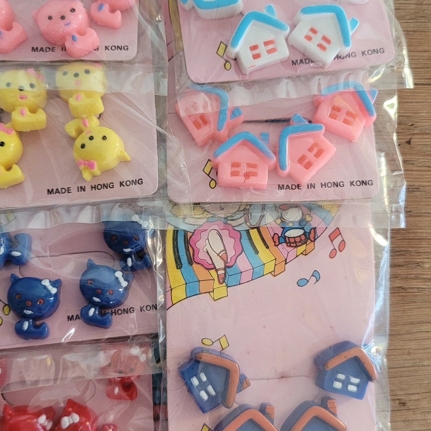 Deadstock sheet display of vintage 'New Fashion' novelty plastic hair bobbles