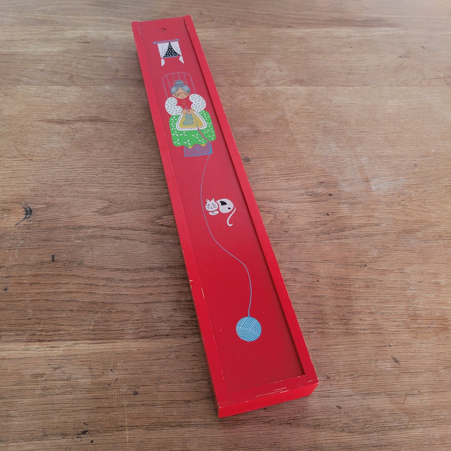 1970s red wooden knitting needle box with sliding lid, granny knitting motif
