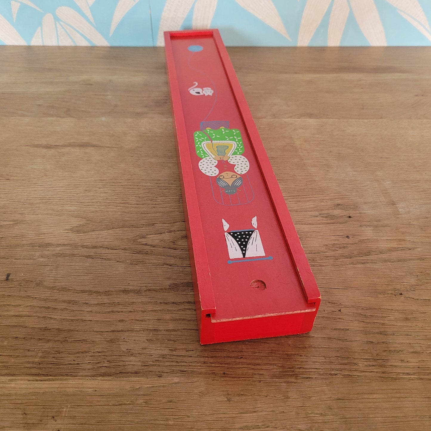 1970s red wooden knitting needle box with sliding lid, granny knitting motif