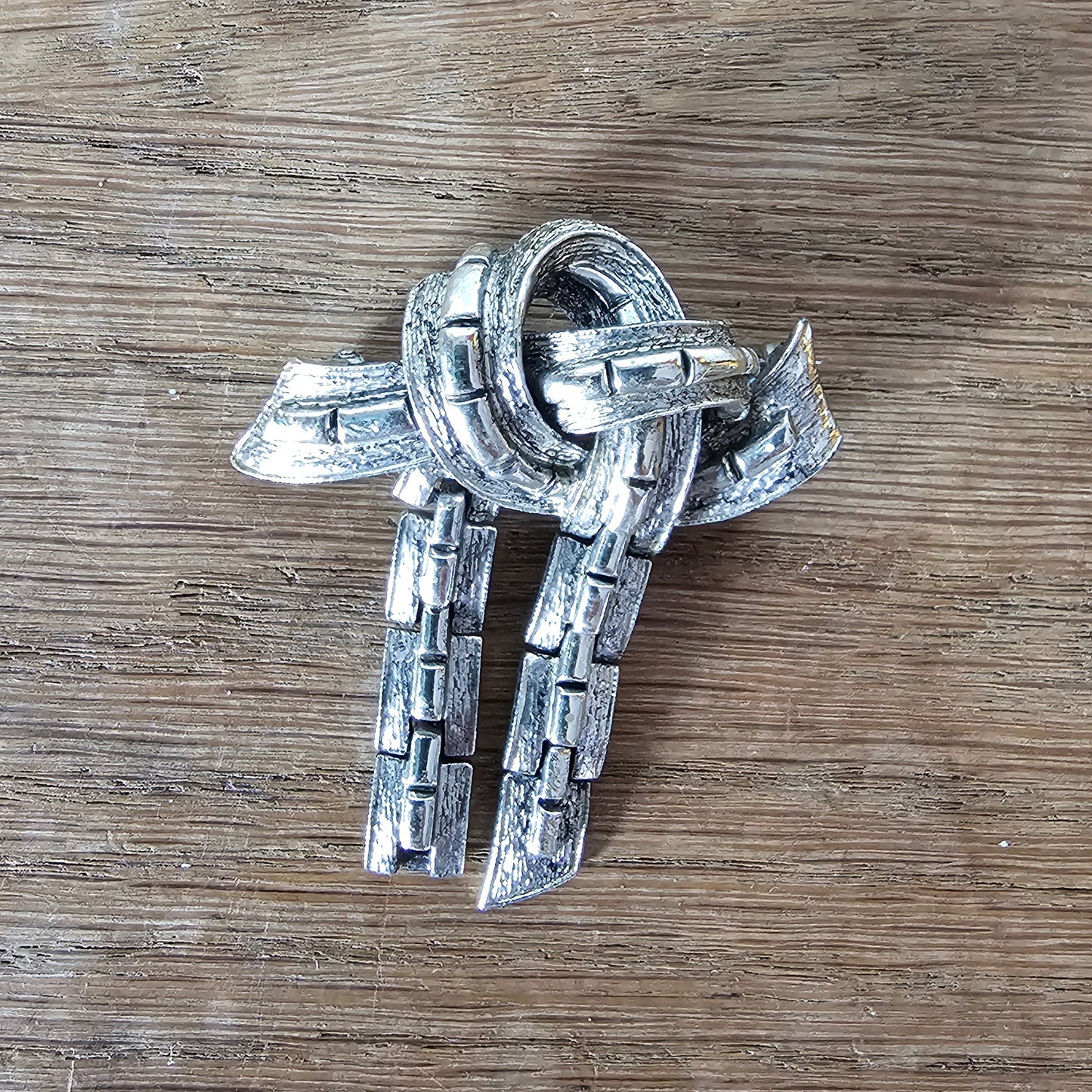 Mid-century Jewelcraft silver-tone articulated knot brooch