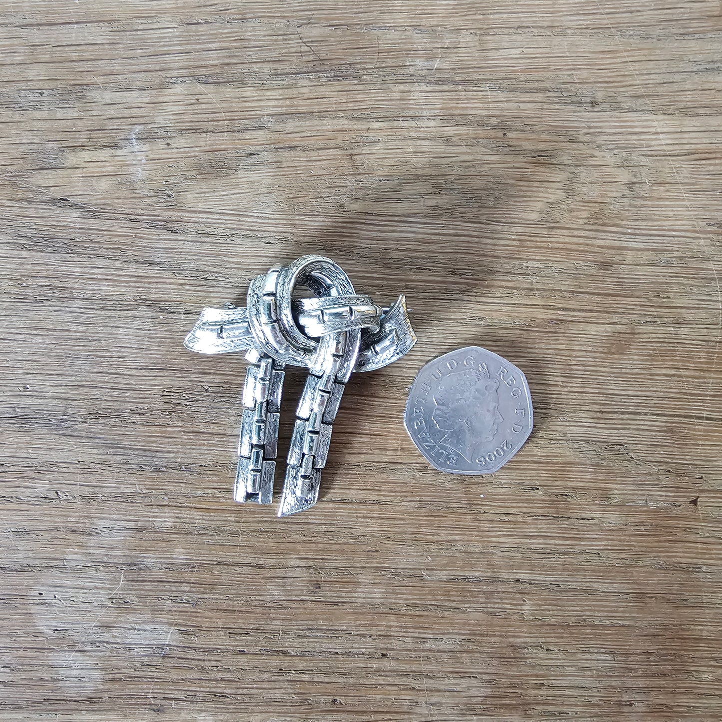 Mid-century Jewelcraft silver-tone articulated knot brooch