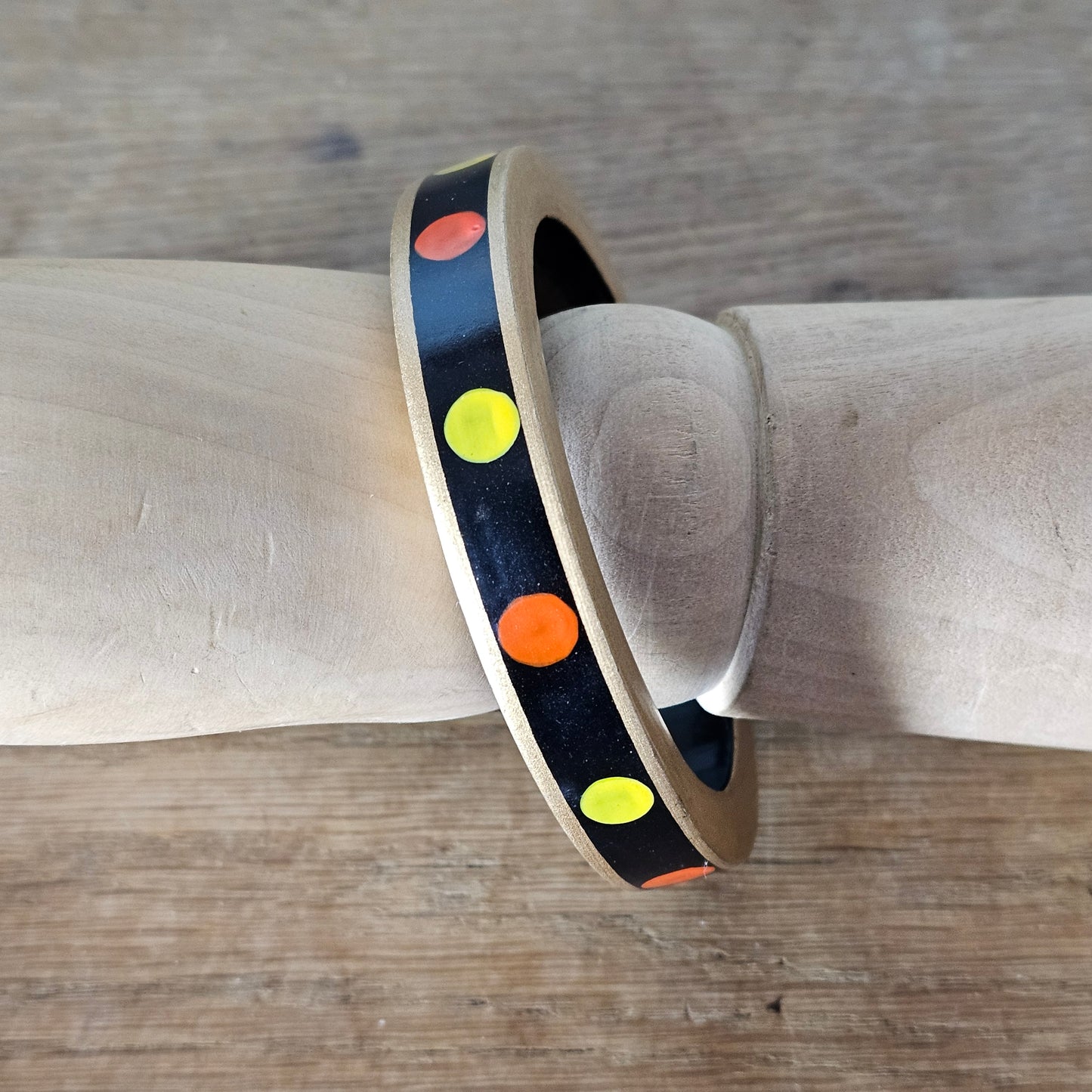 1970s hand-painted black/gold wooden bangle with yellow & orange dot detail