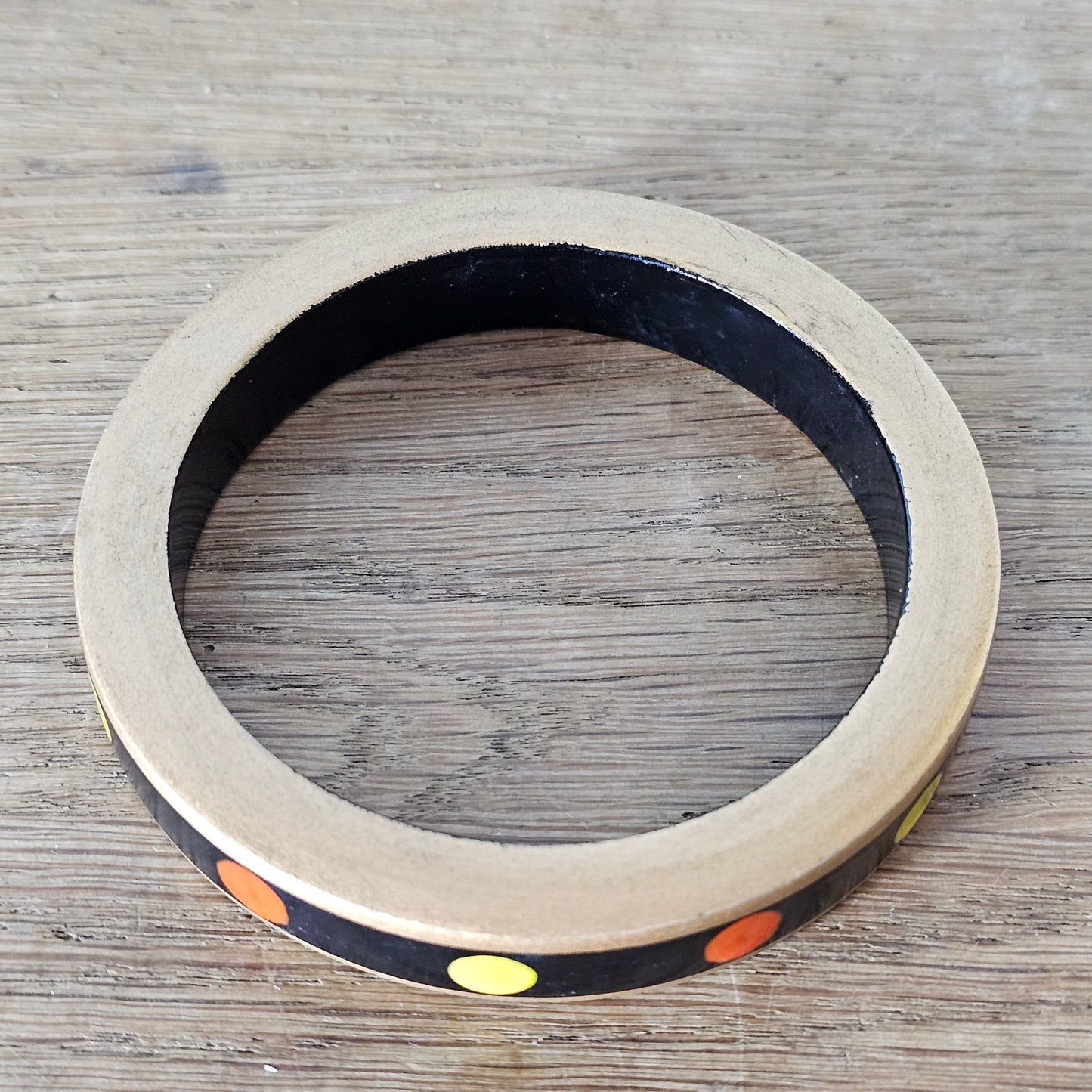 1970s hand-painted black/gold wooden bangle with yellow & orange dot detail