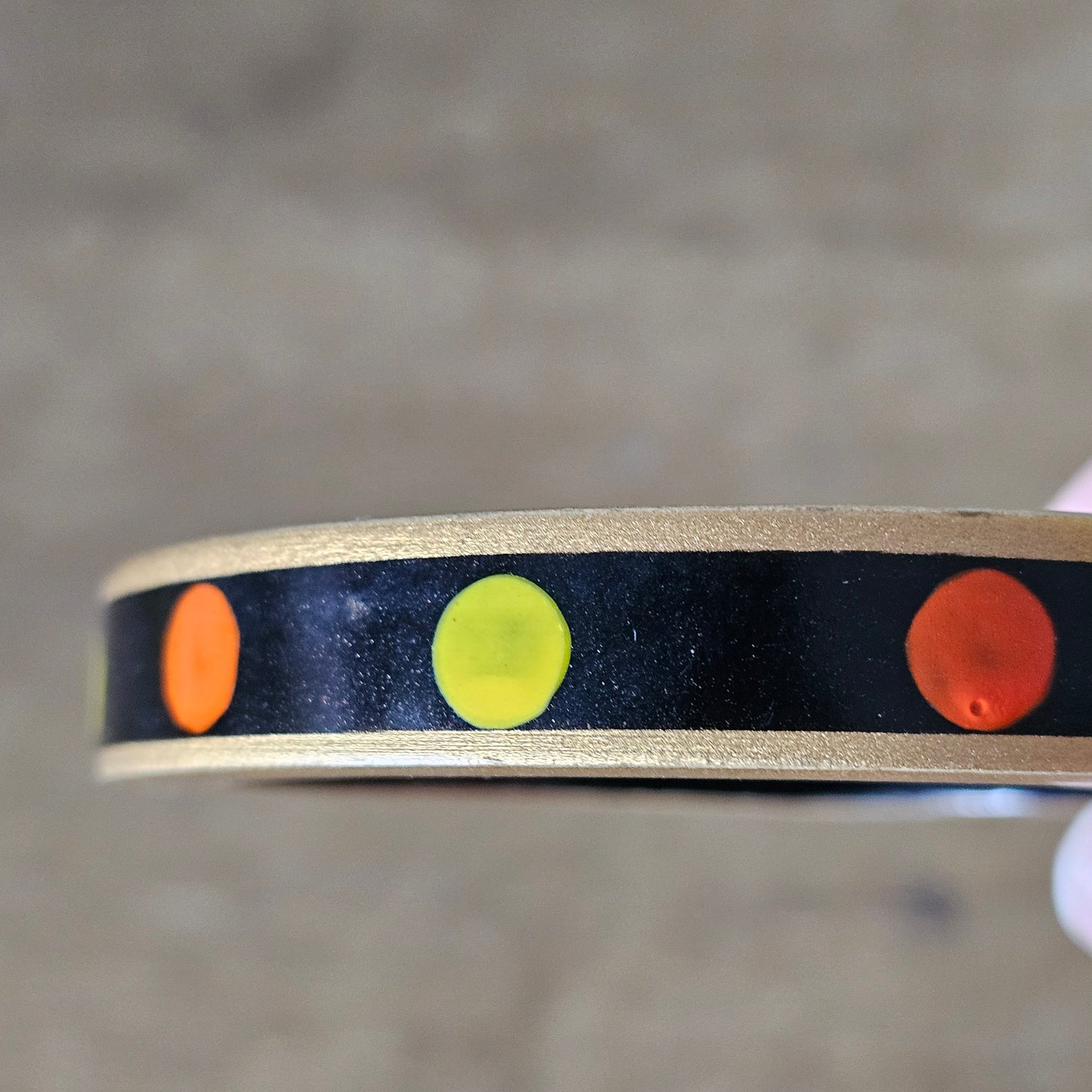 1970s hand-painted black/gold wooden bangle with yellow & orange dot detail