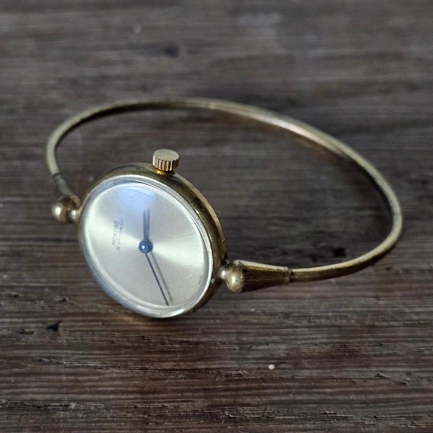circa. 1970s Montine Swiss made minimalist gold-tone ladies bangle watch
