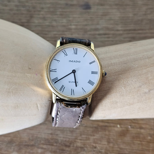 Vintage gold-tone Imado Quartz Roman numeral men's watch with leather strap