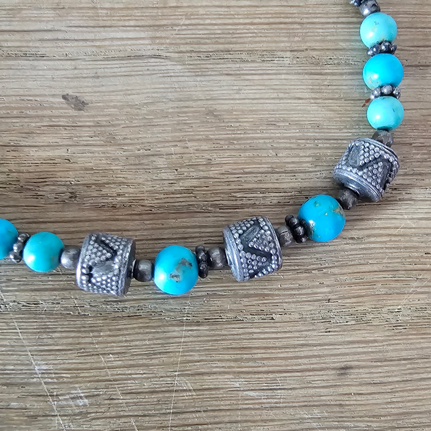 1990s turquoise stone bead necklace with tribal style silver tone spacers