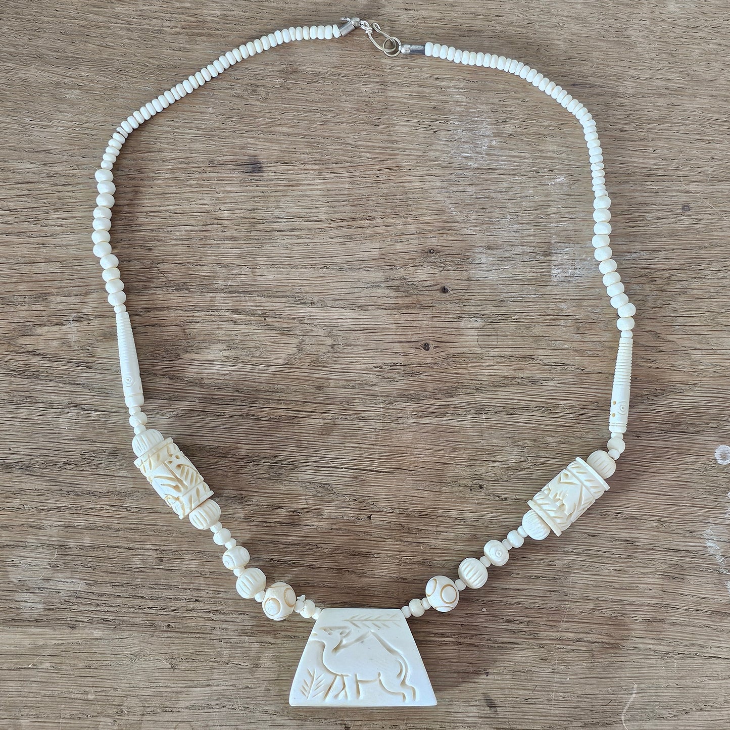 circa. 1970s ivory-tone bone necklace with carved animal detail