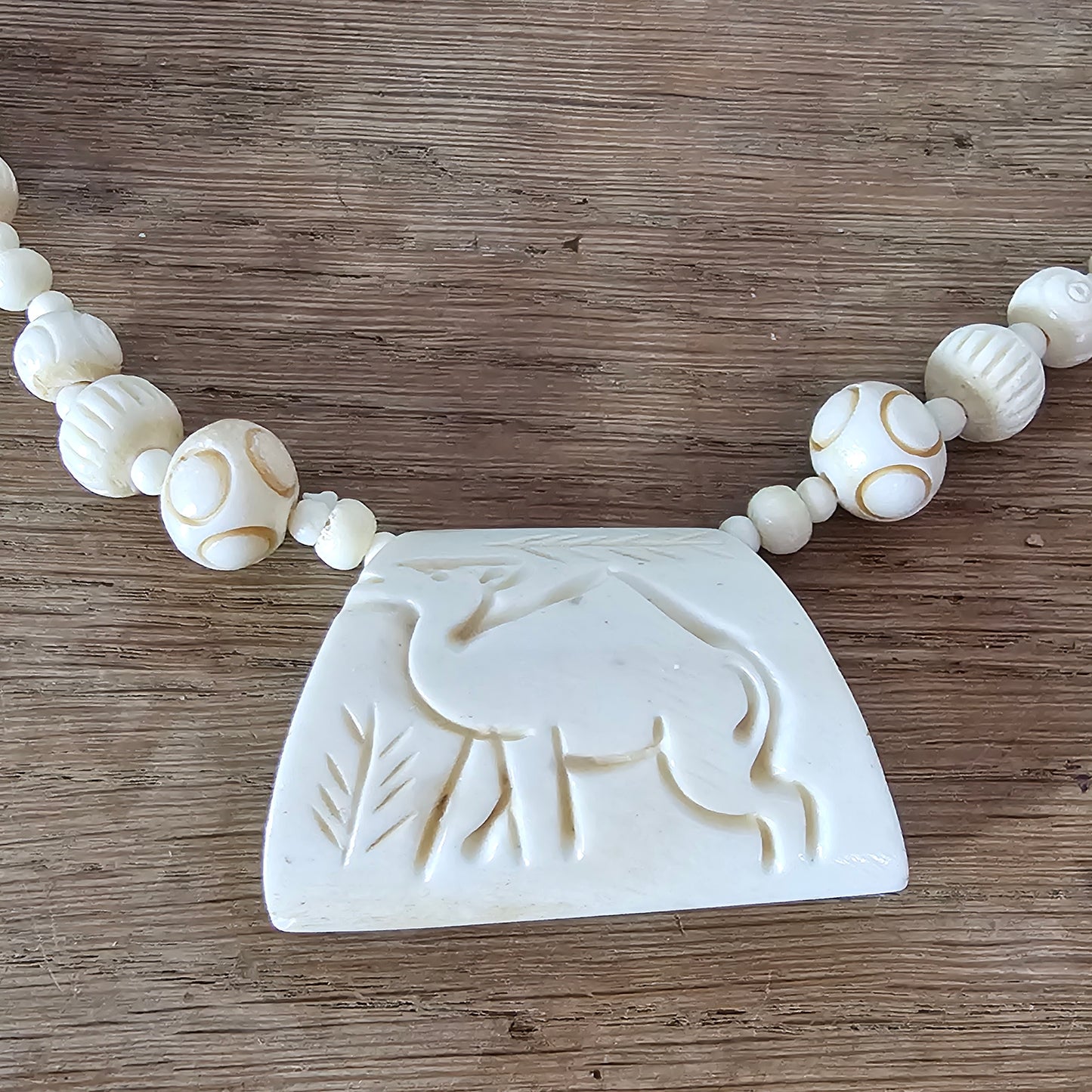 circa. 1970s ivory-tone bone necklace with carved animal detail