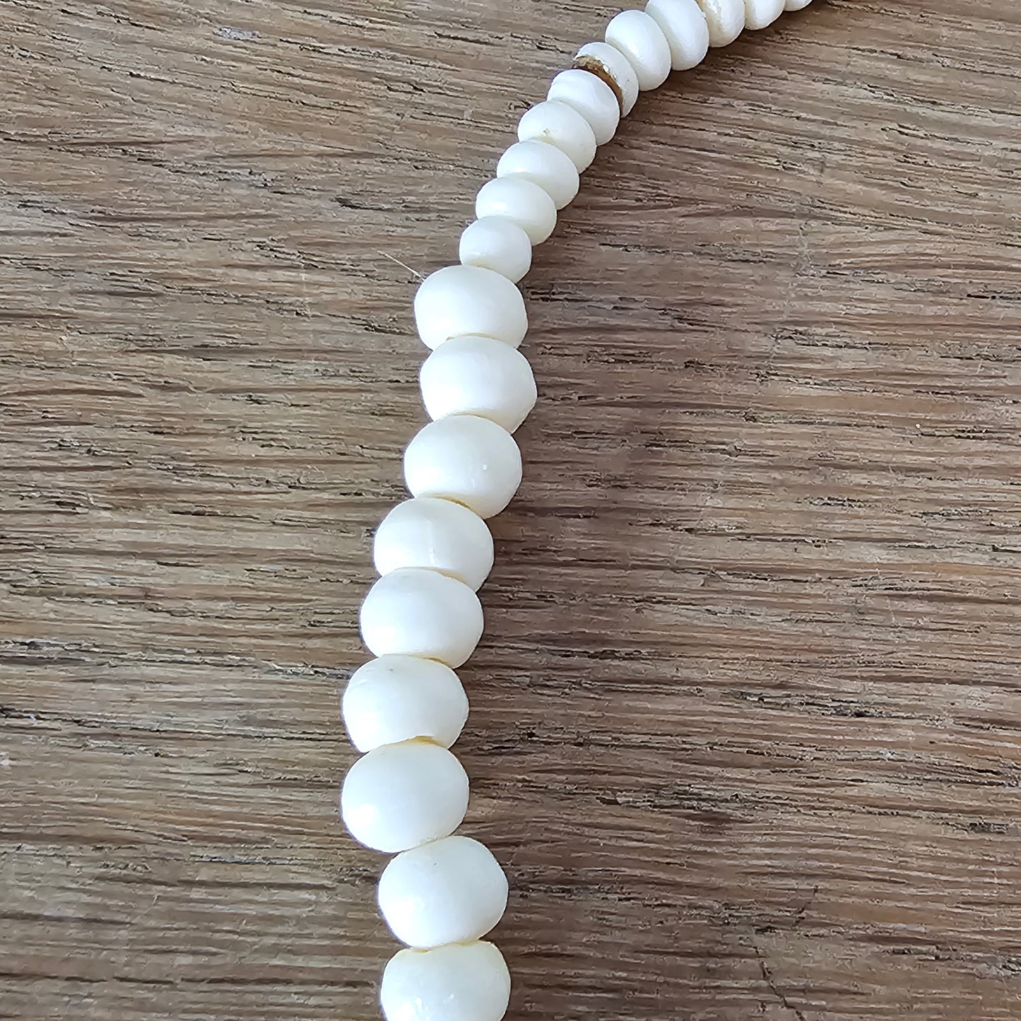 circa. 1970s ivory-tone bone necklace with carved animal detail