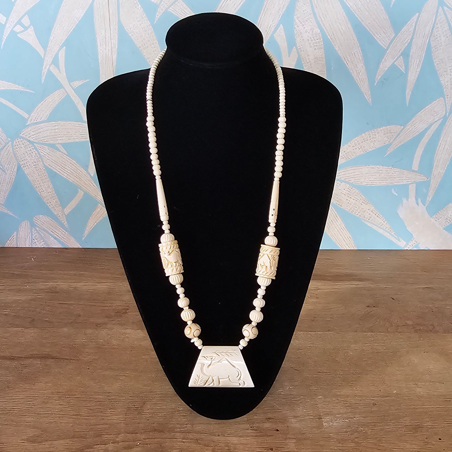 circa. 1970s ivory-tone bone necklace with carved animal detail