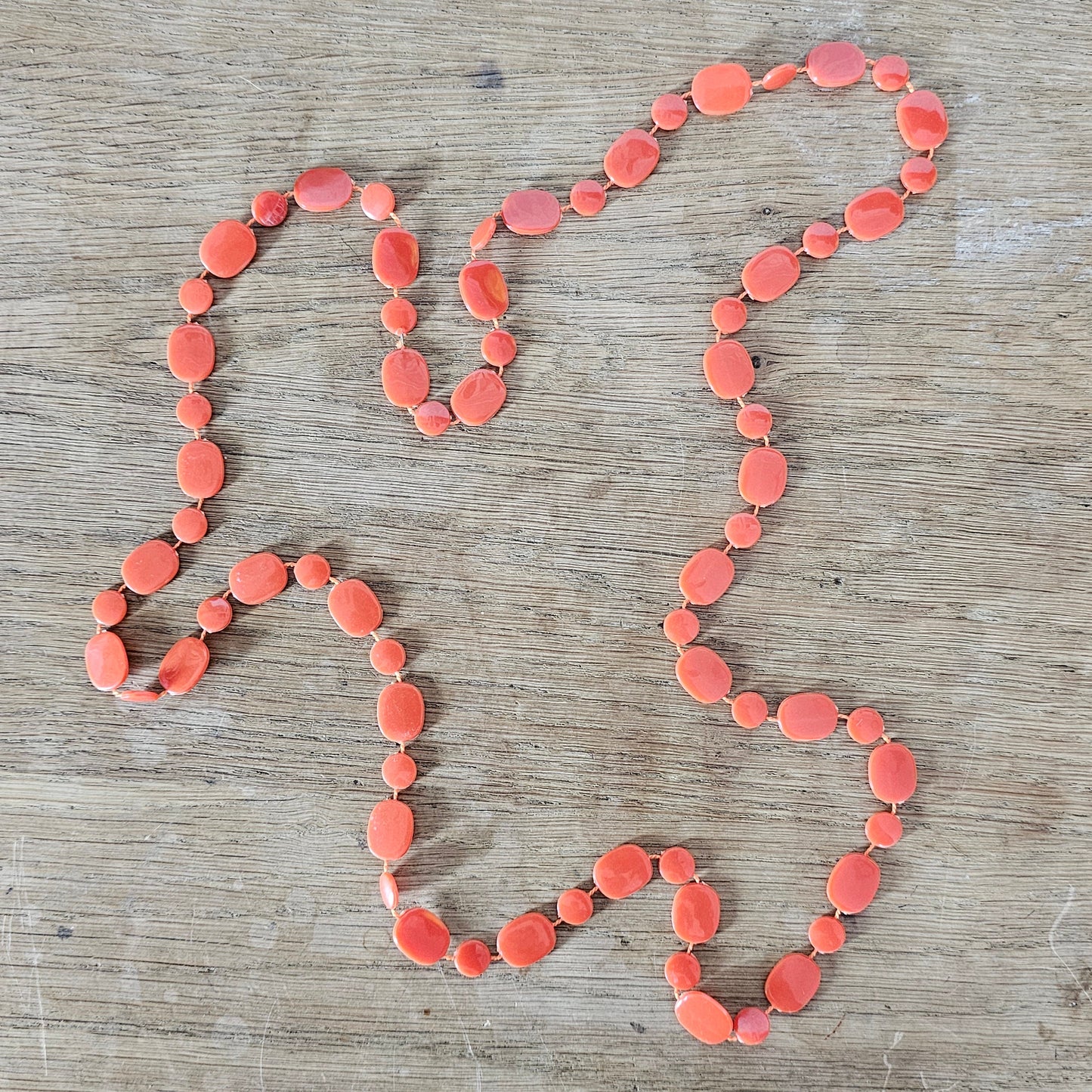 1970s coral/orange Lucite beaded rope necklace