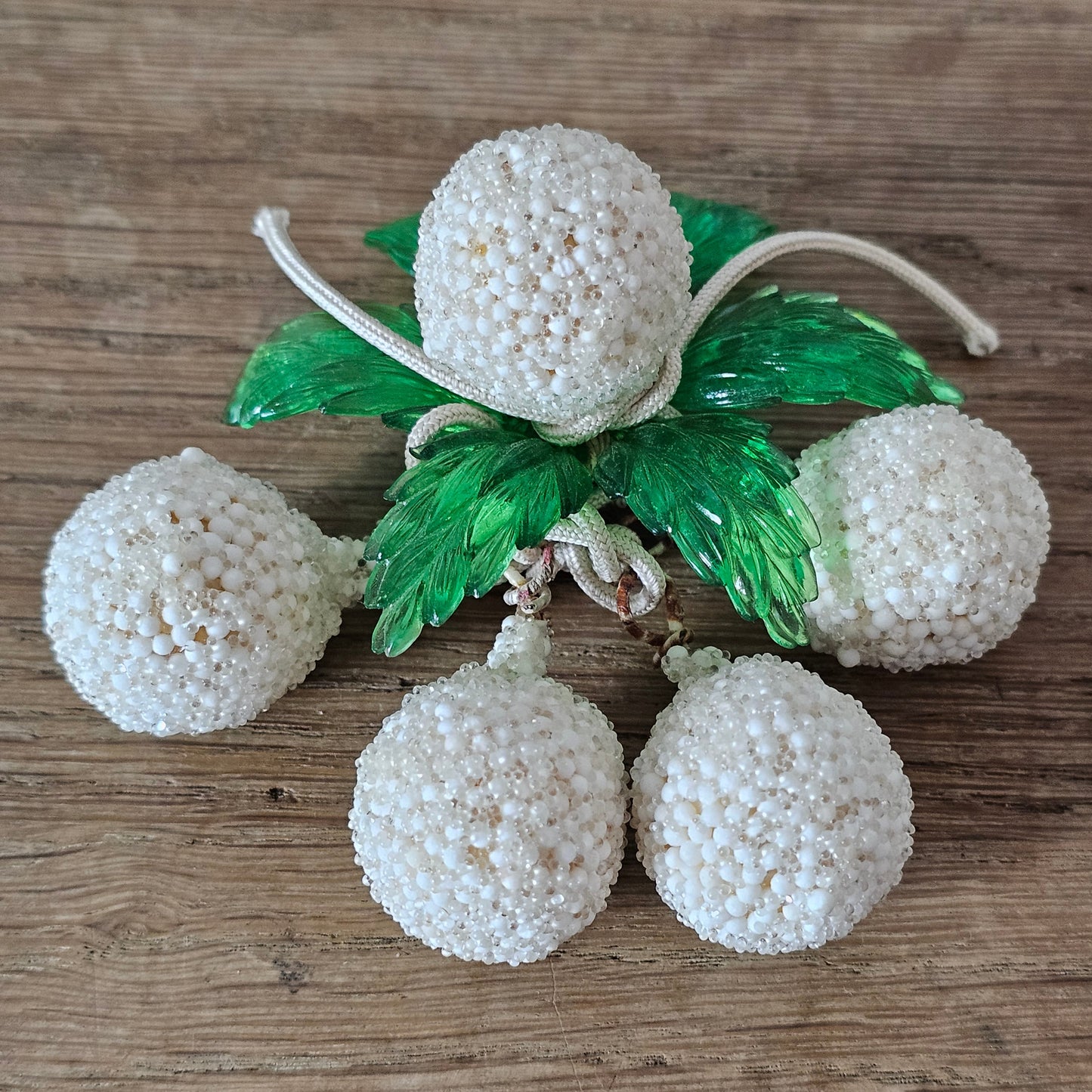 1940s white seed bead cluster fruit brooch with green lucite leaves