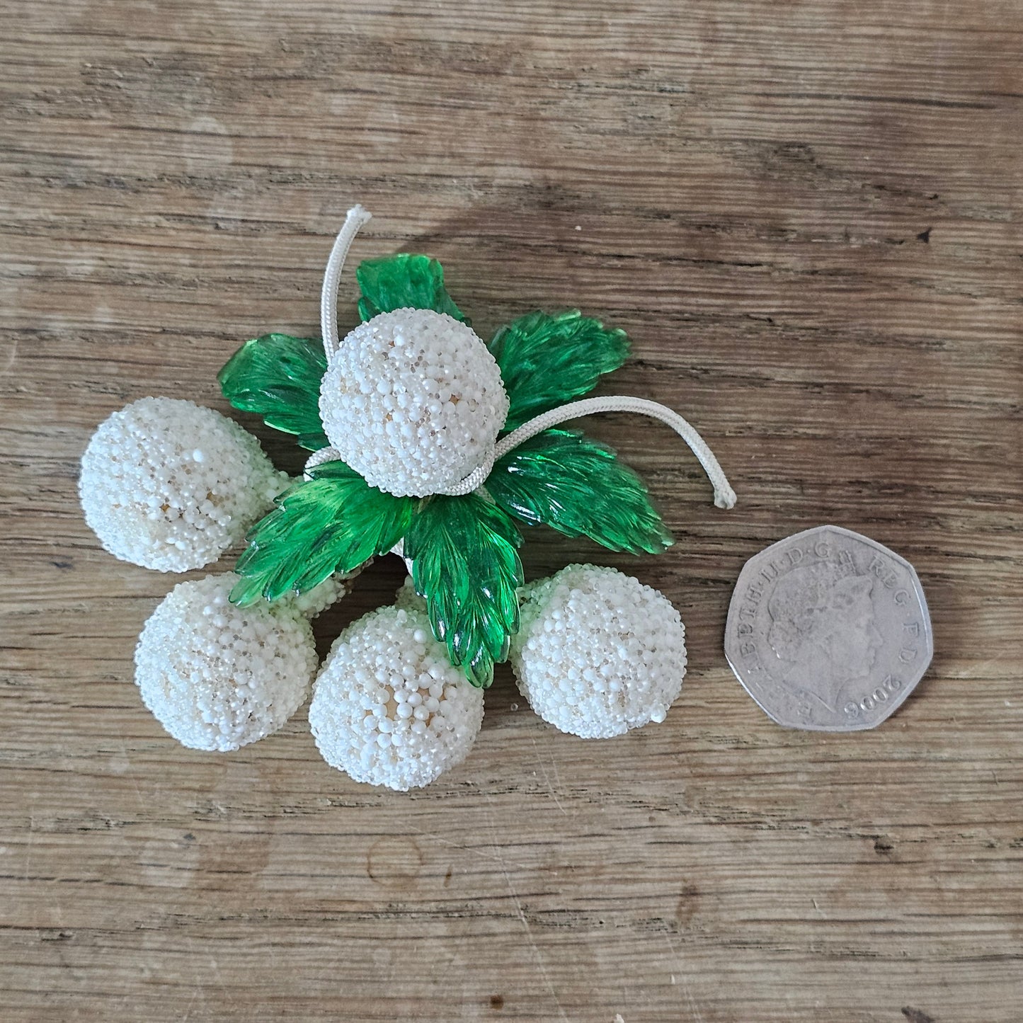 1940s white seed bead cluster fruit brooch with green lucite leaves