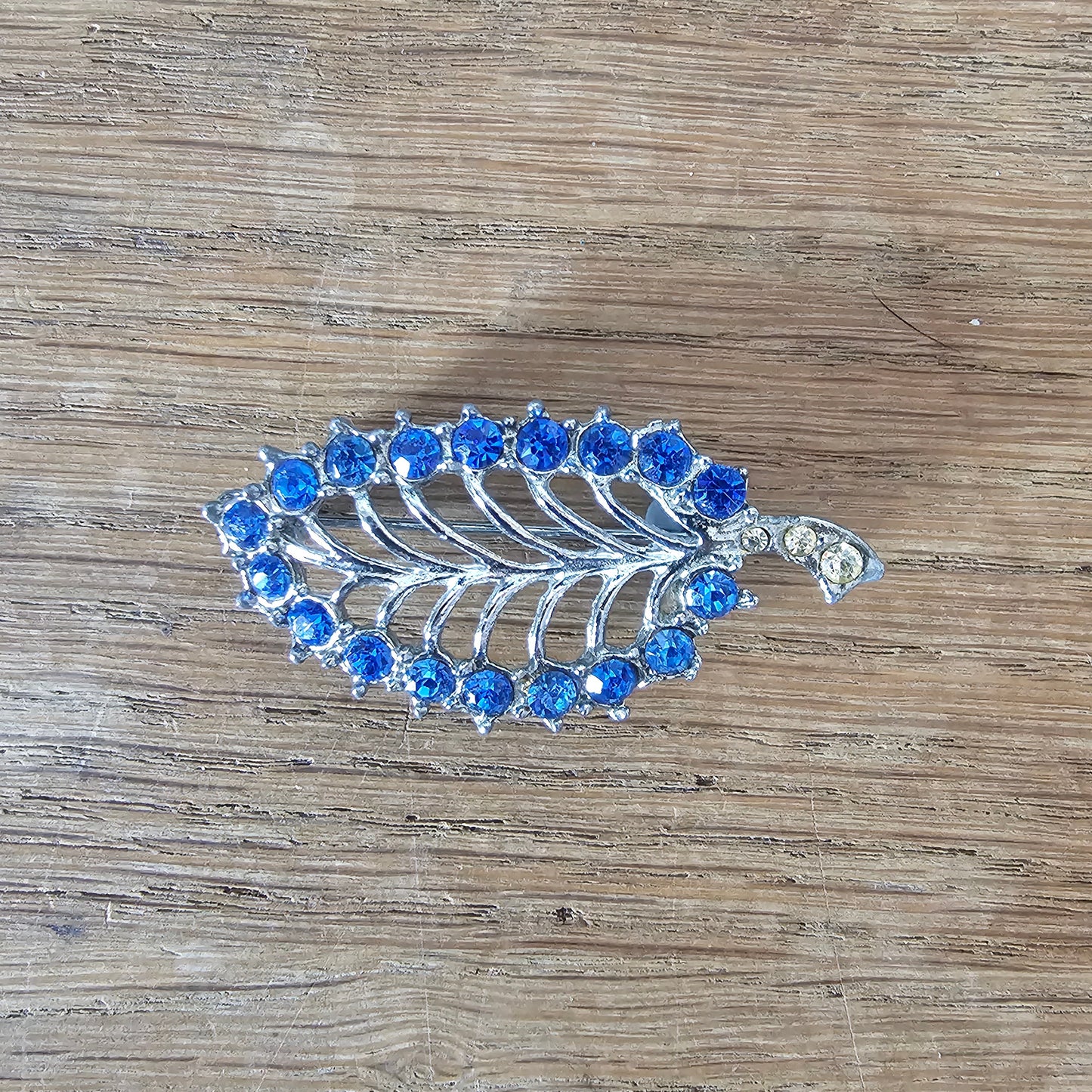 1950s silver-tone & blue rhinestone skeletal leaf brooch