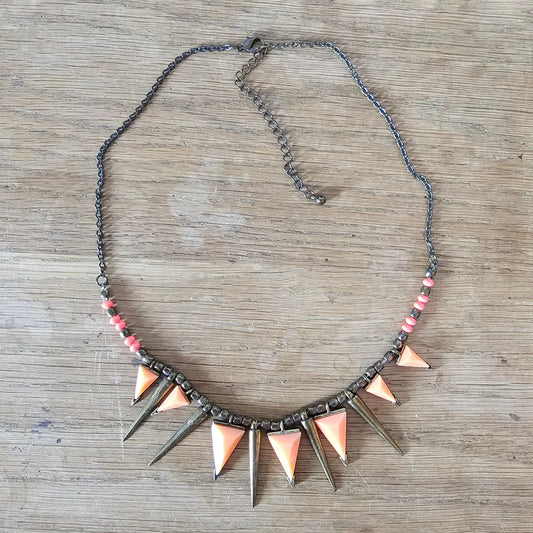 Vintage-style gold tone & coral spike triangle statement necklace