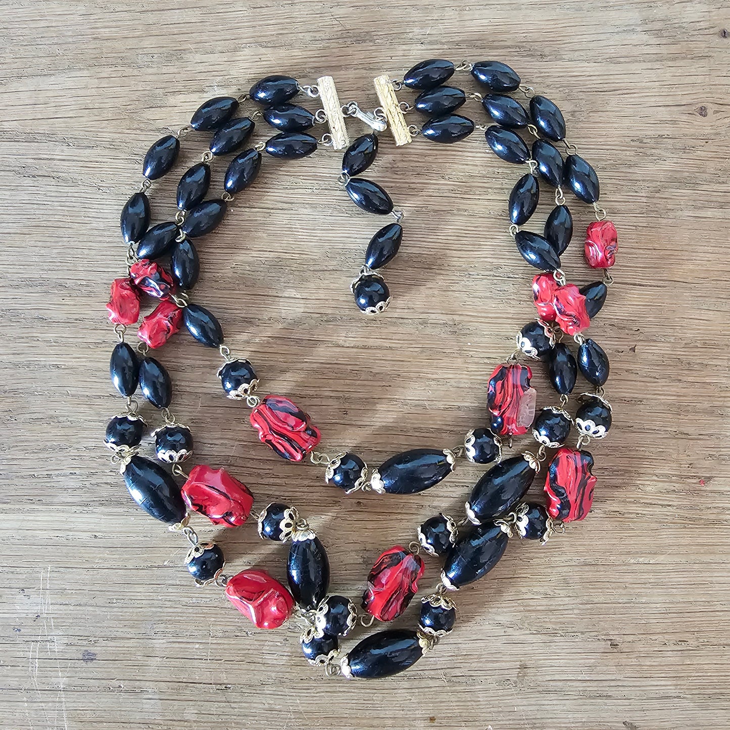 1960s red & black triple strand plastic bead necklace