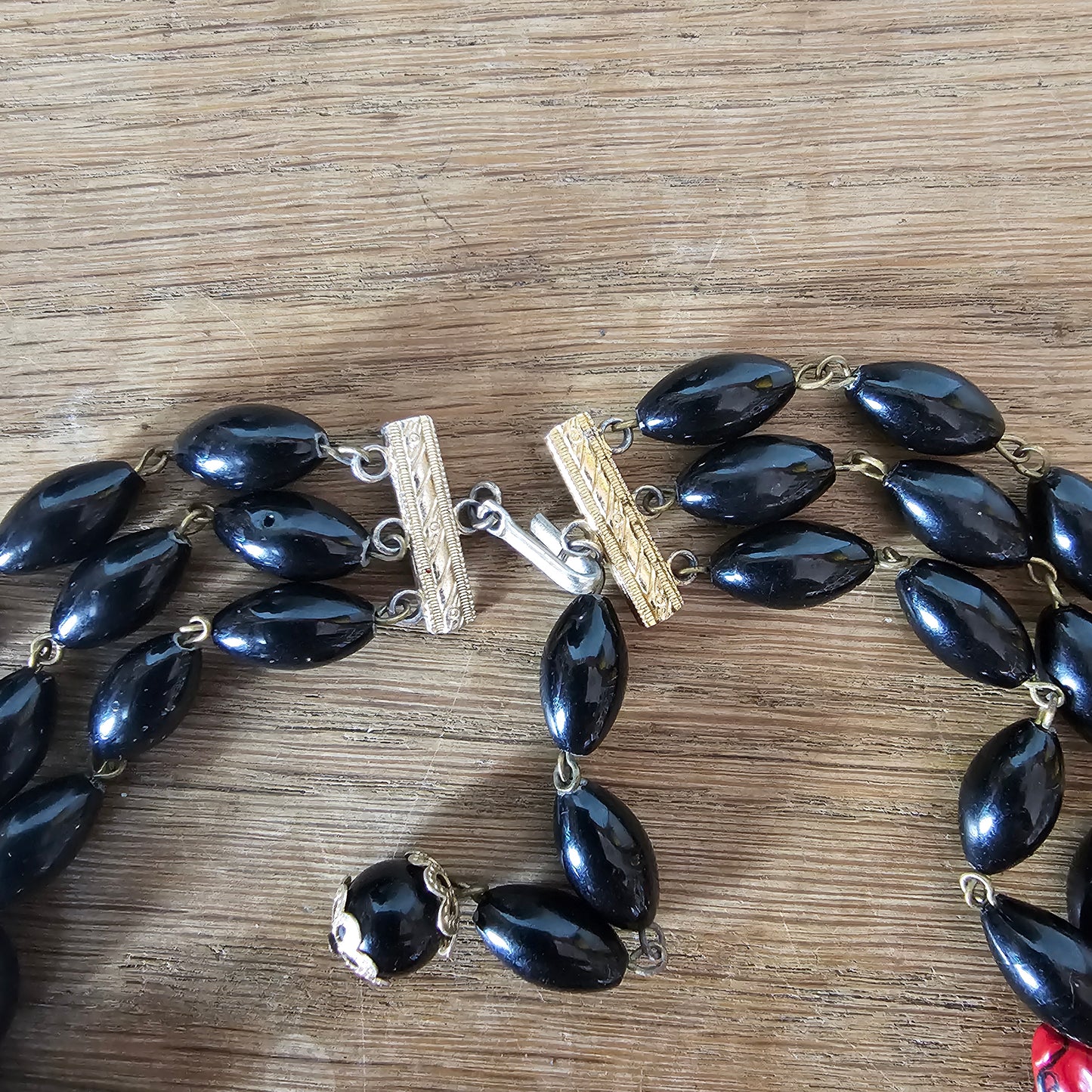 1960s red & black triple strand plastic bead necklace