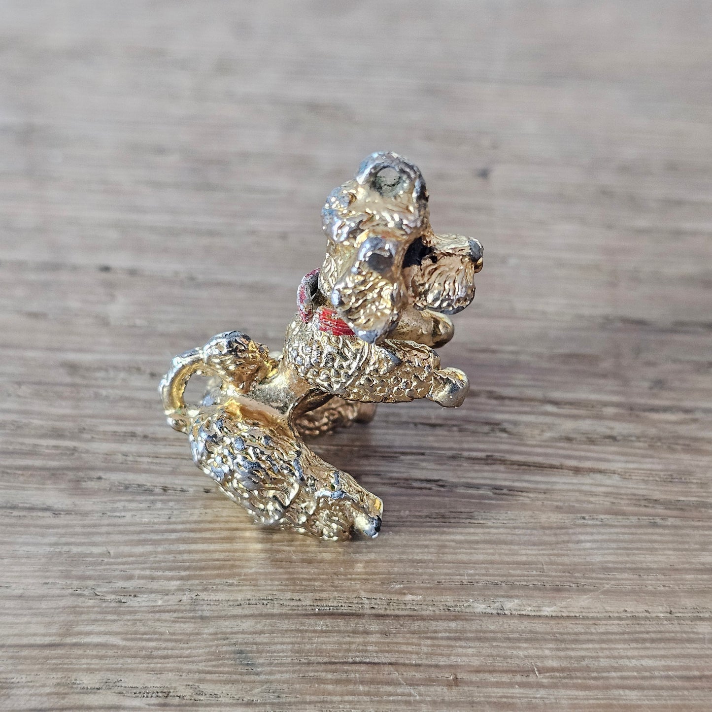 Vintage gold-tone begging French poodle pendant with red collar