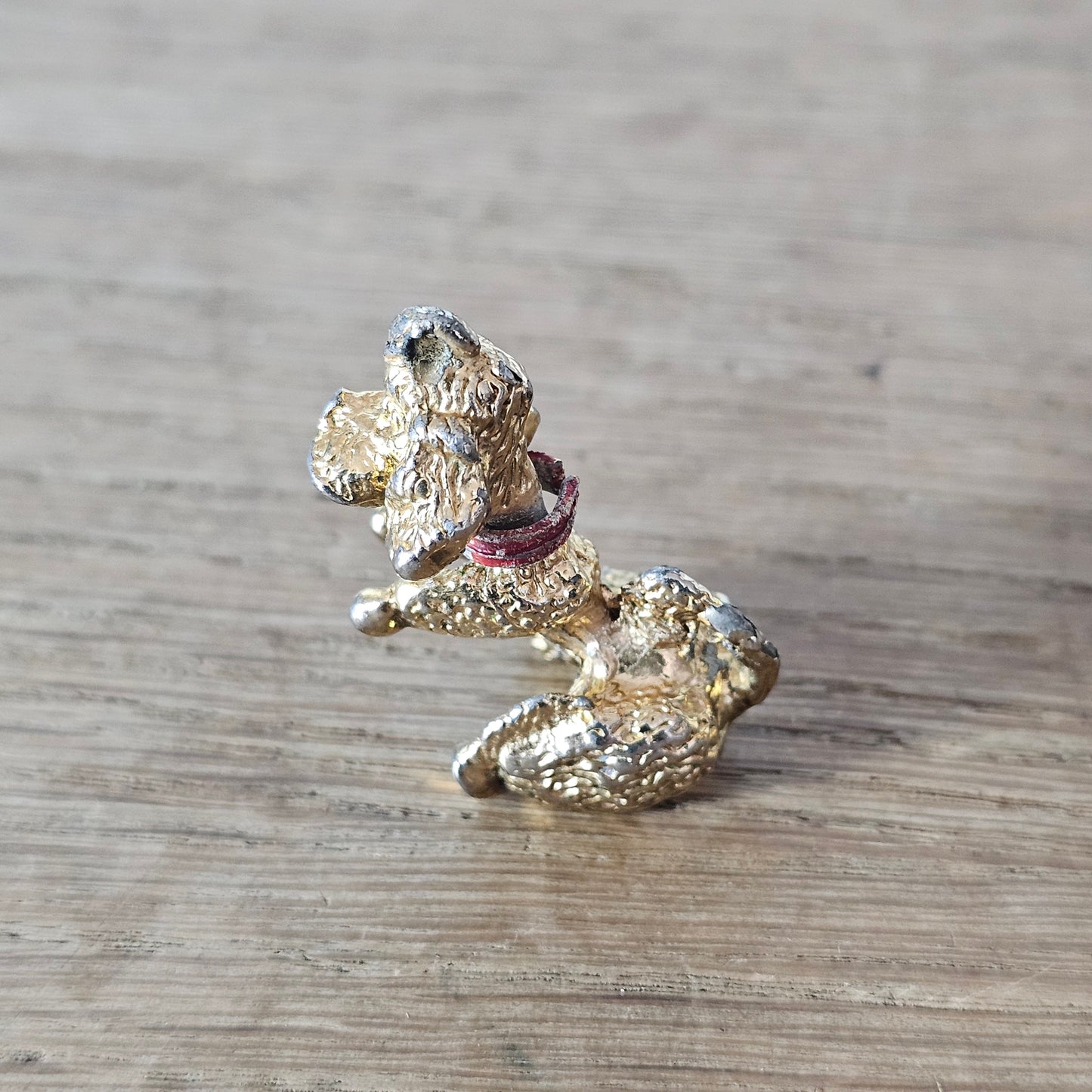 Vintage gold-tone begging French poodle pendant with red collar