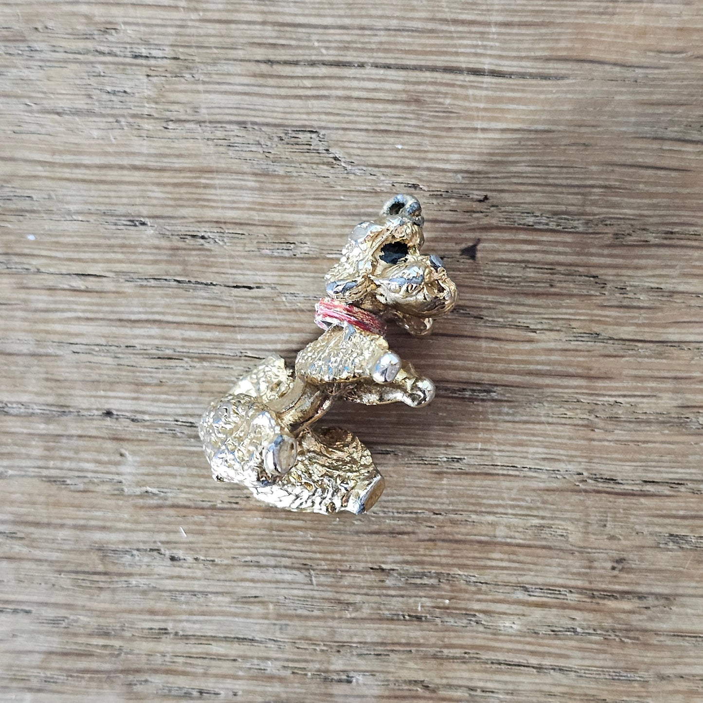 Vintage gold-tone begging French poodle pendant with red collar