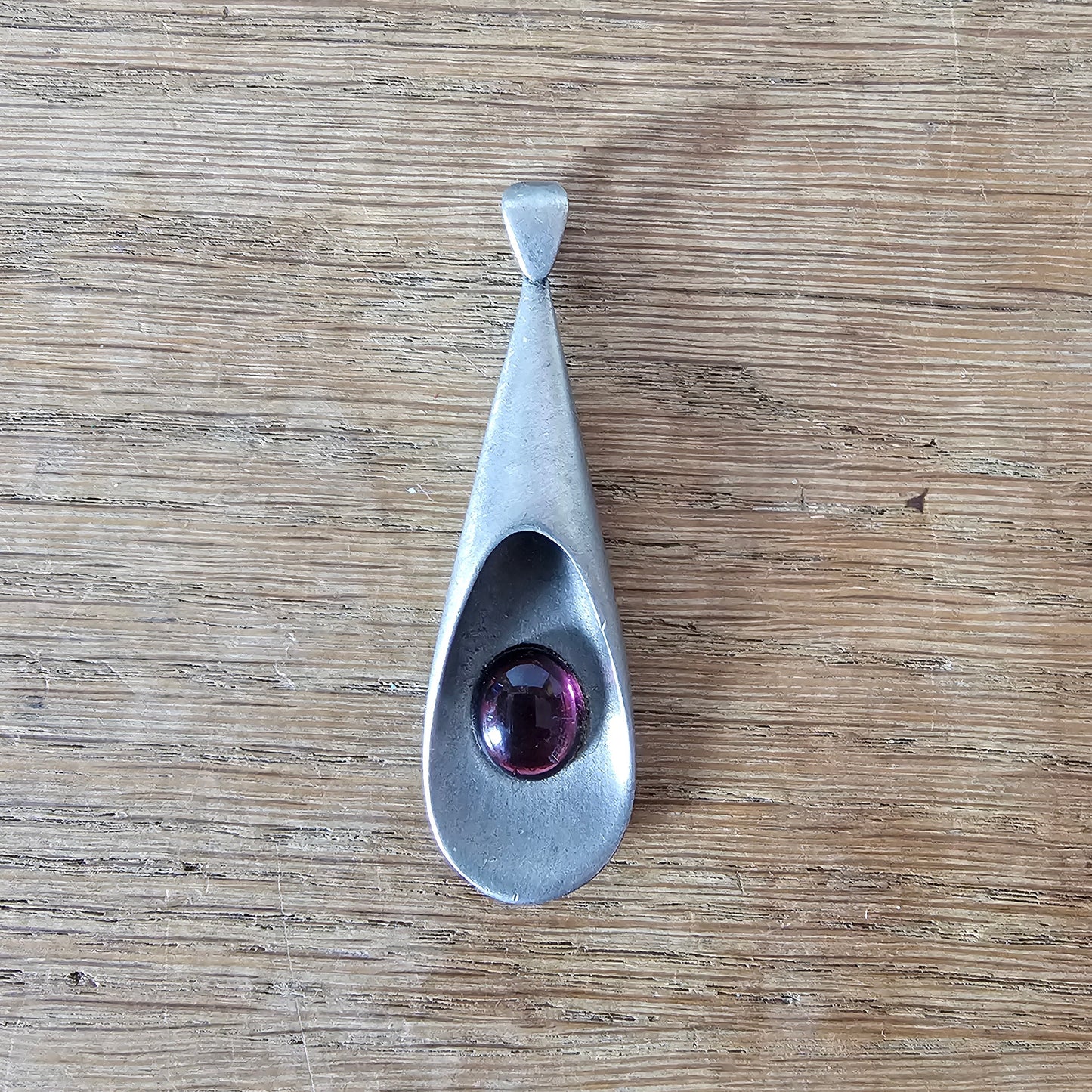 1960s pewter pendant with amethyst glass cabochon
