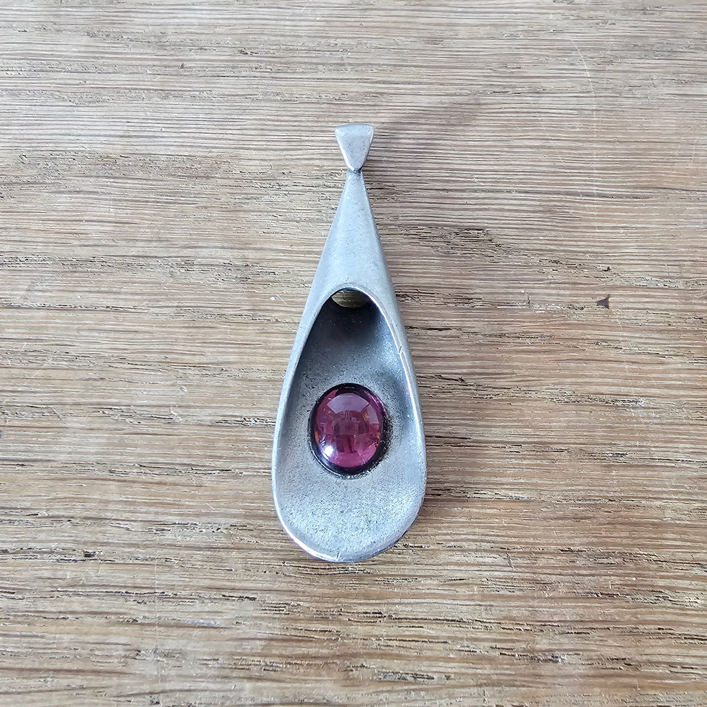 1960s pewter pendant with amethyst glass cabochon