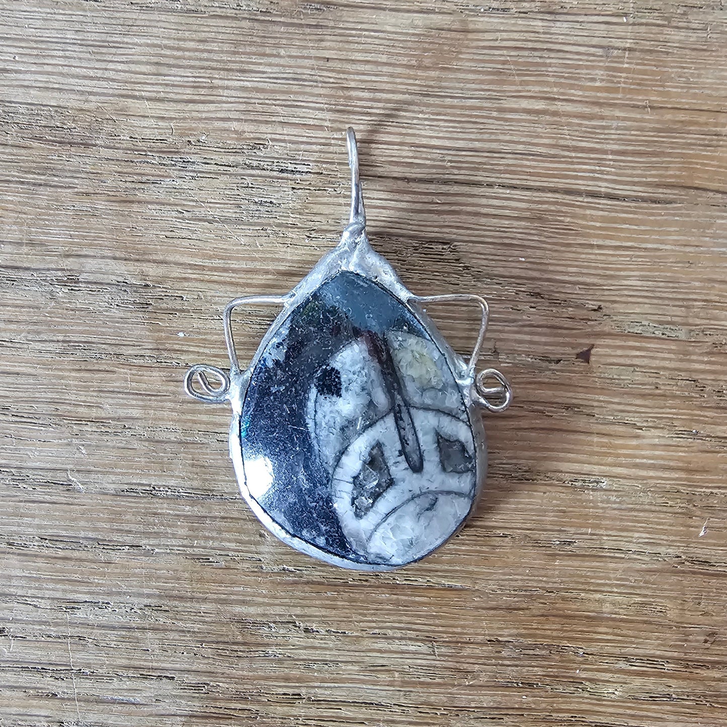 1970s/80s orthoceras fossil stone pendant in hand-crafted metal setting