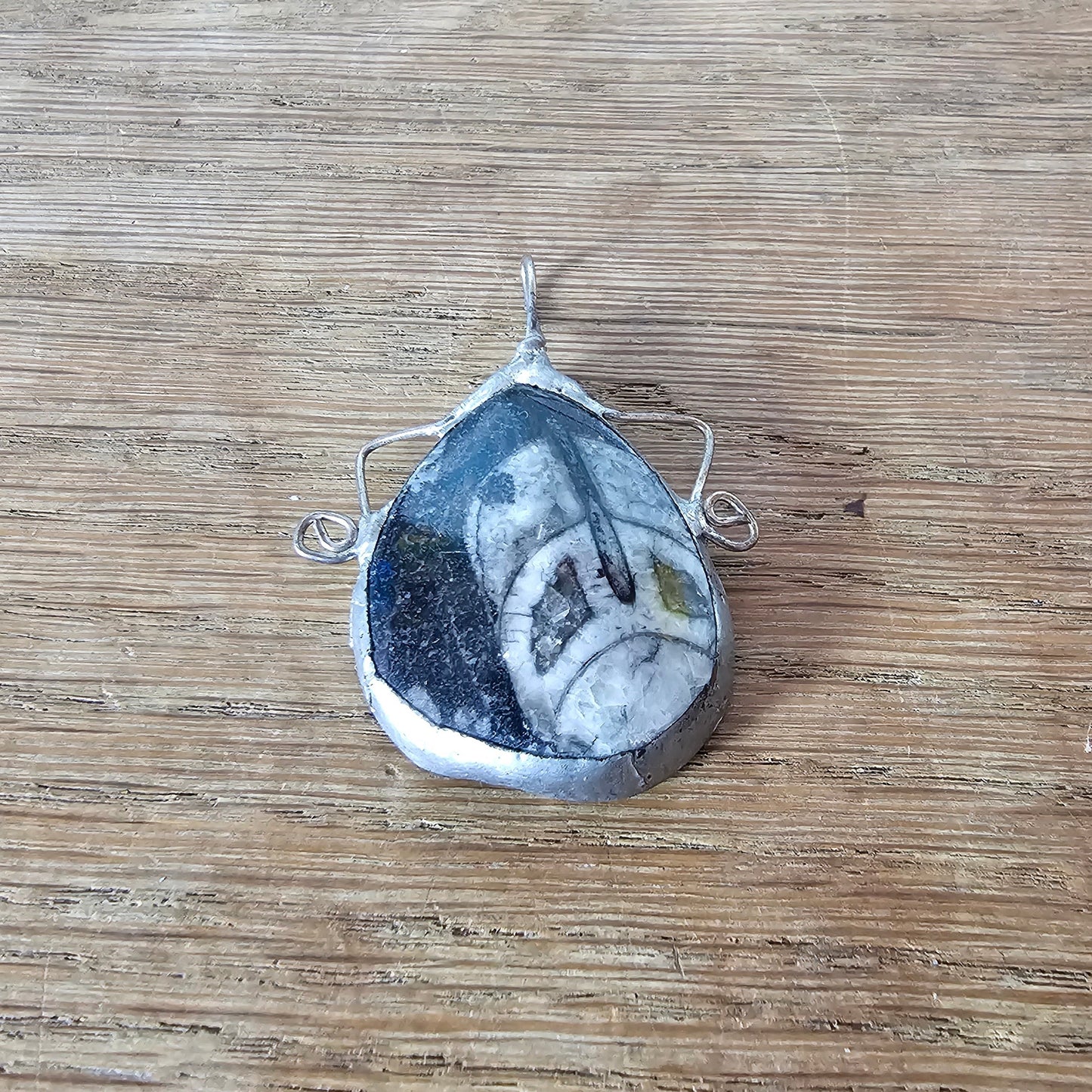 1970s/80s orthoceras fossil stone pendant in hand-crafted metal setting