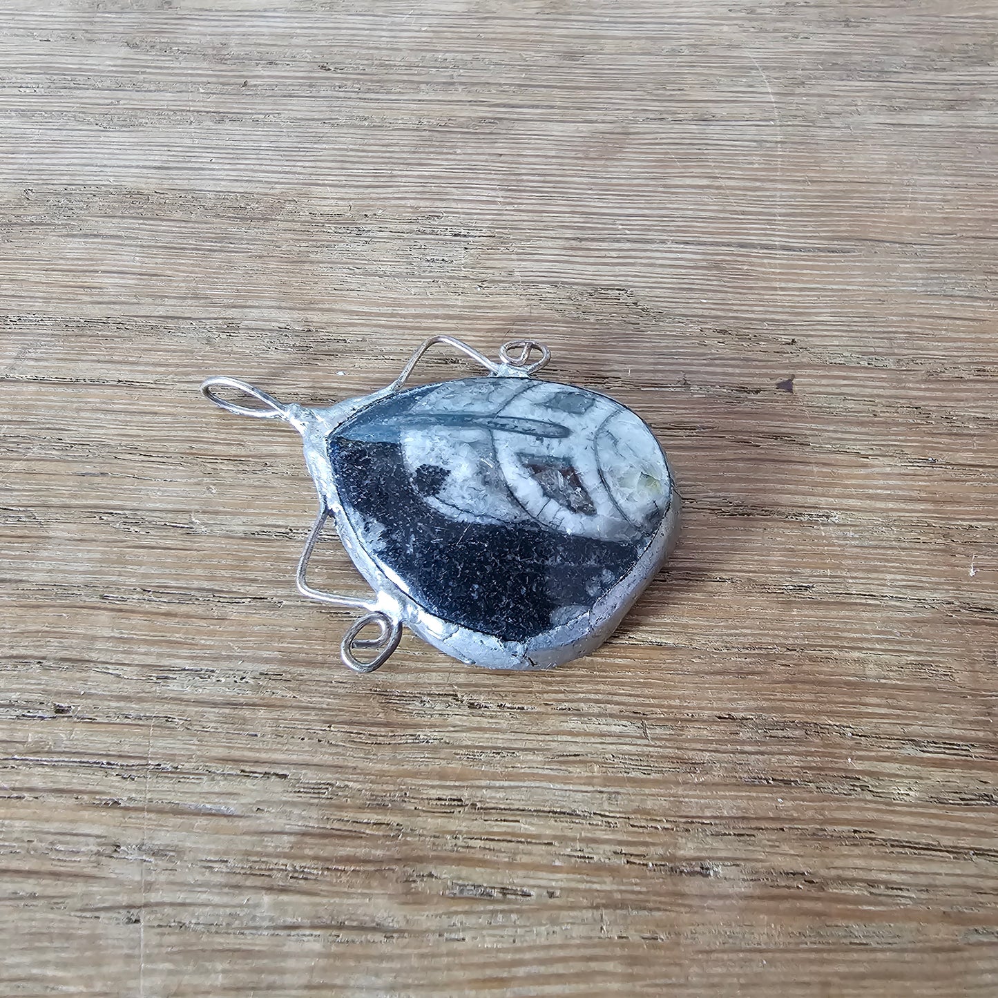 1970s/80s orthoceras fossil stone pendant in hand-crafted metal setting