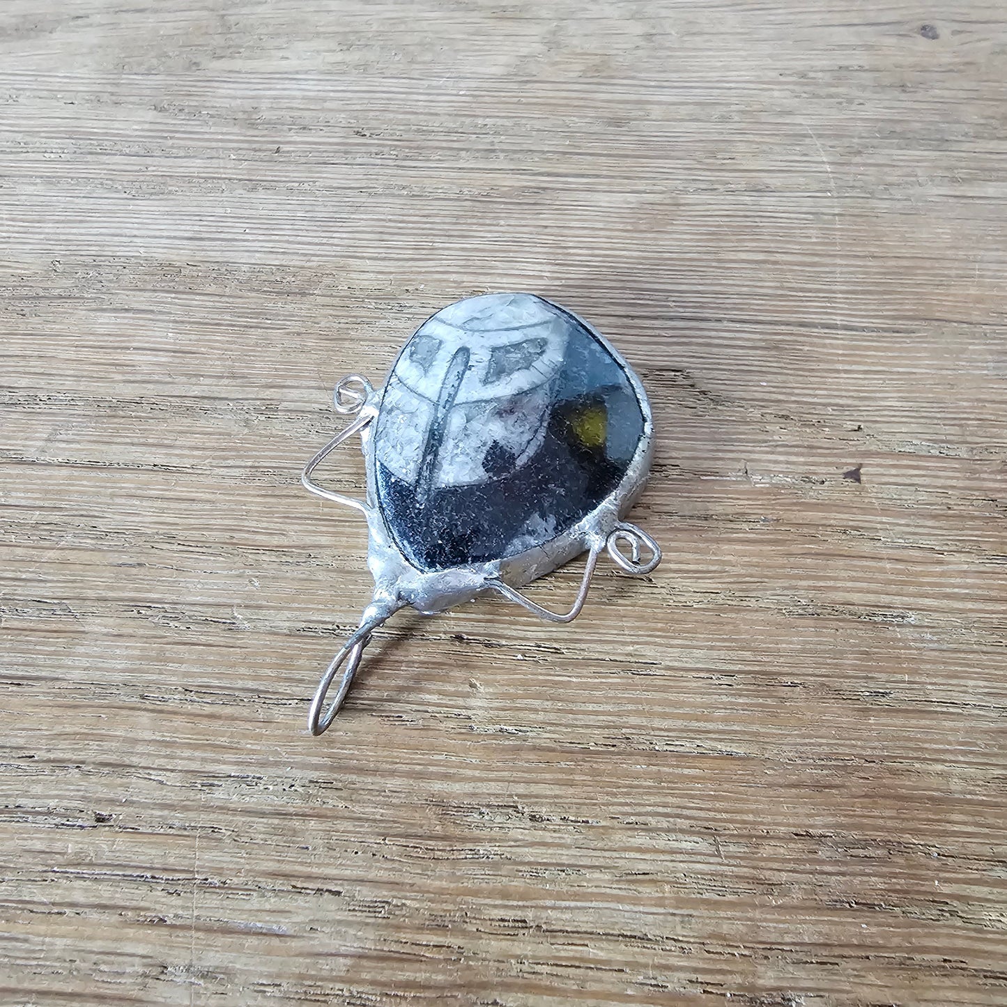1970s/80s orthoceras fossil stone pendant in hand-crafted metal setting