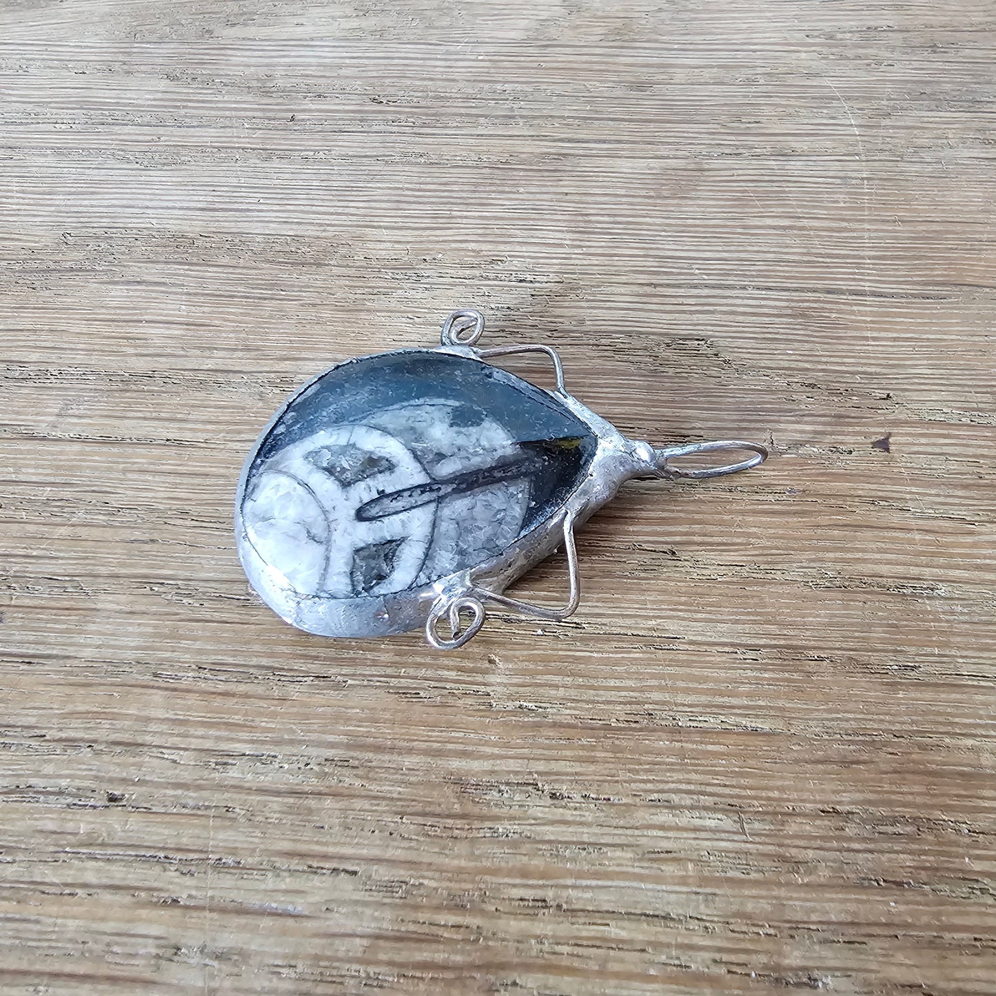 1970s/80s orthoceras fossil stone pendant in hand-crafted metal setting
