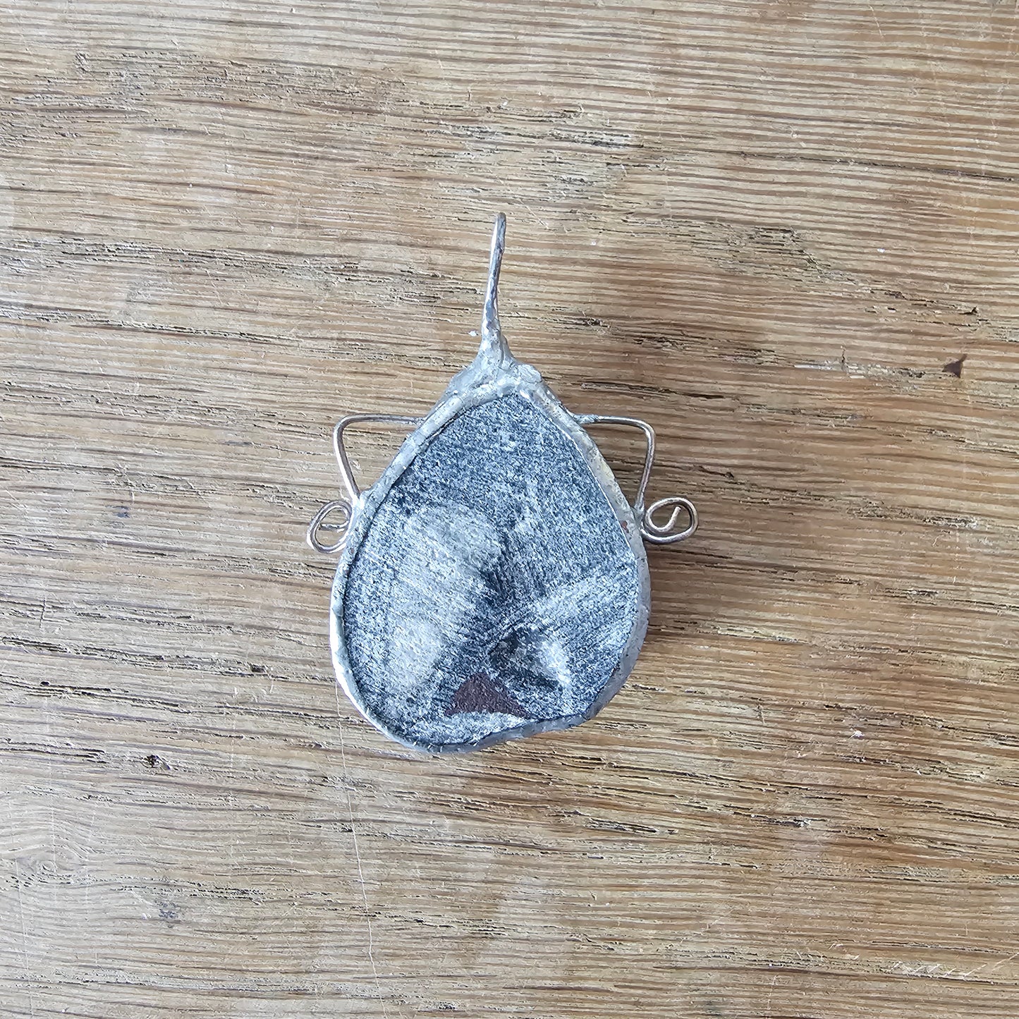 1970s/80s orthoceras fossil stone pendant in hand-crafted metal setting