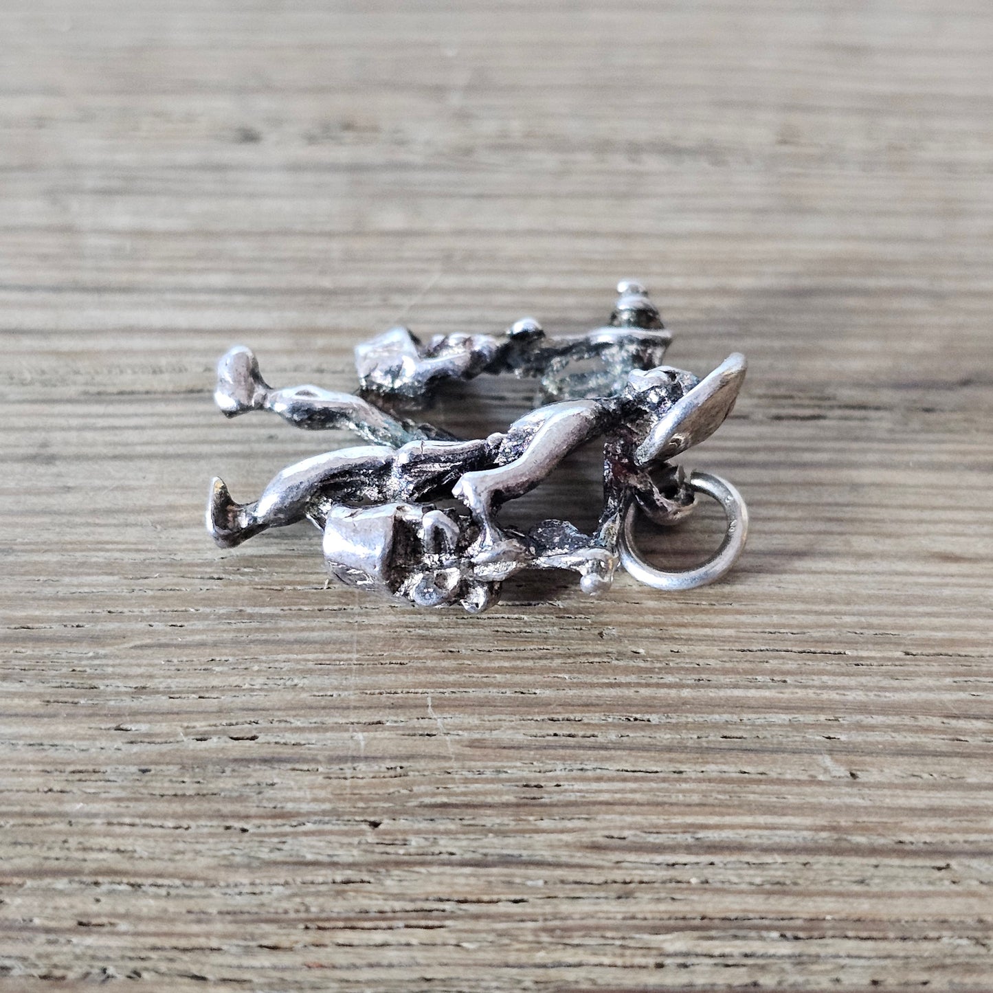 circa. 1970s silver-tone figural water carrier charm