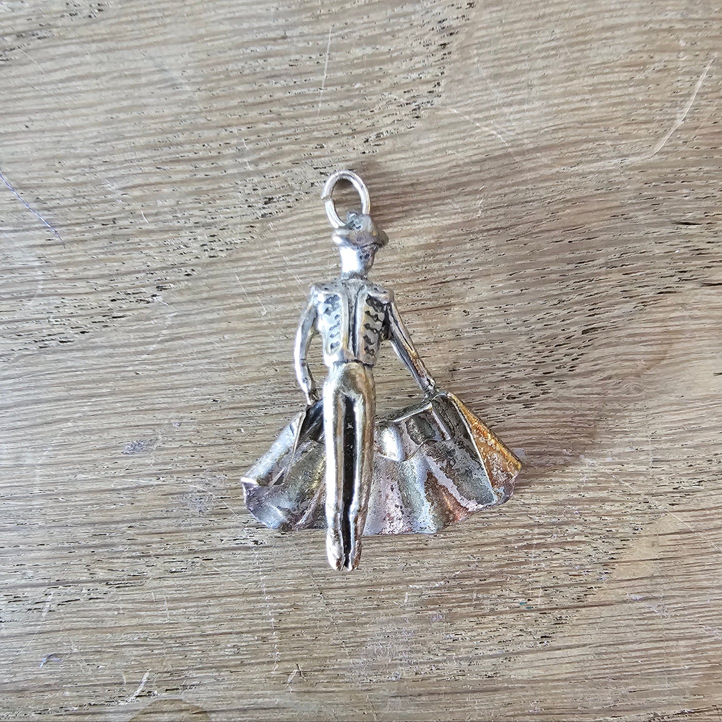 Mid-century silver-tone figural matador charm