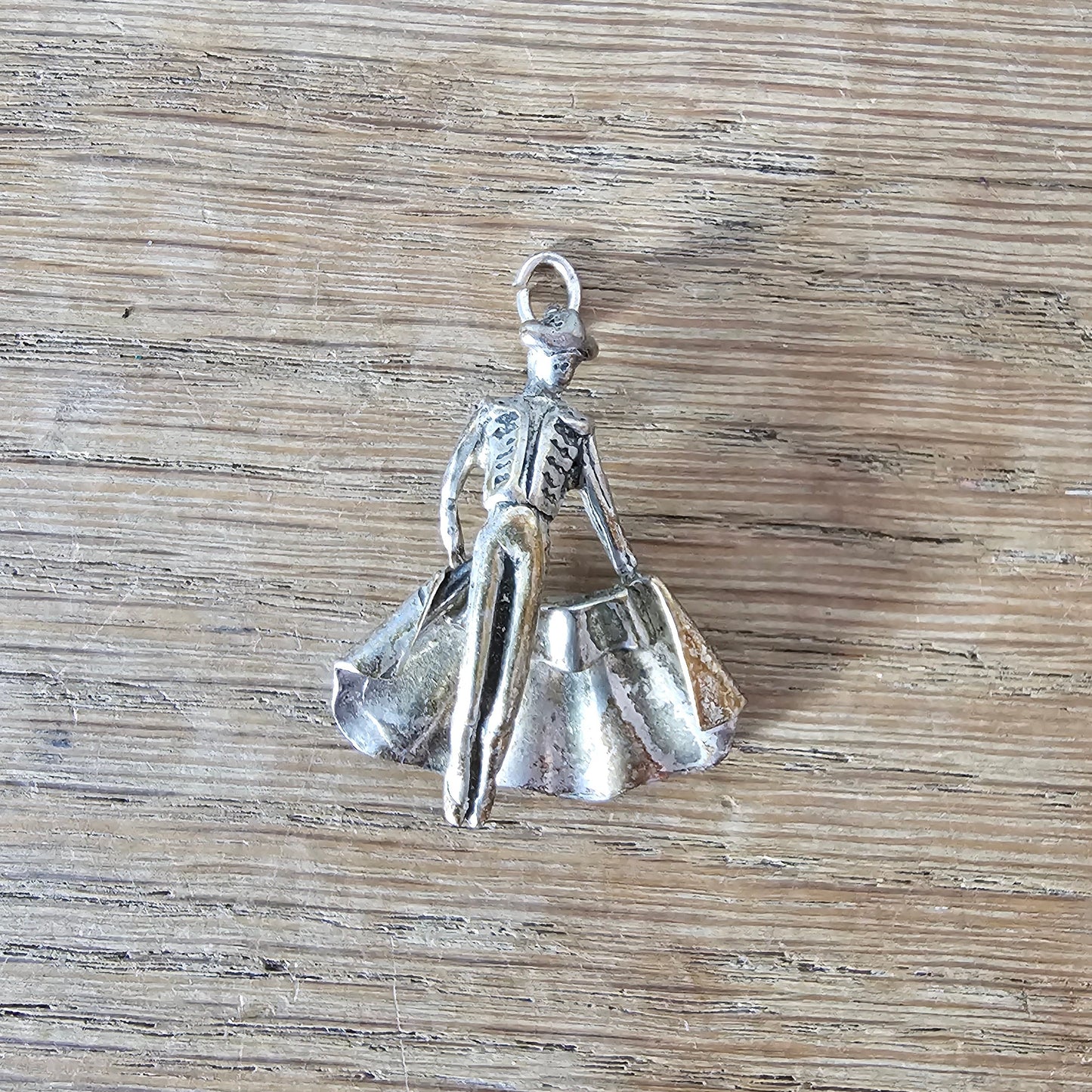 Mid-century silver-tone figural matador charm